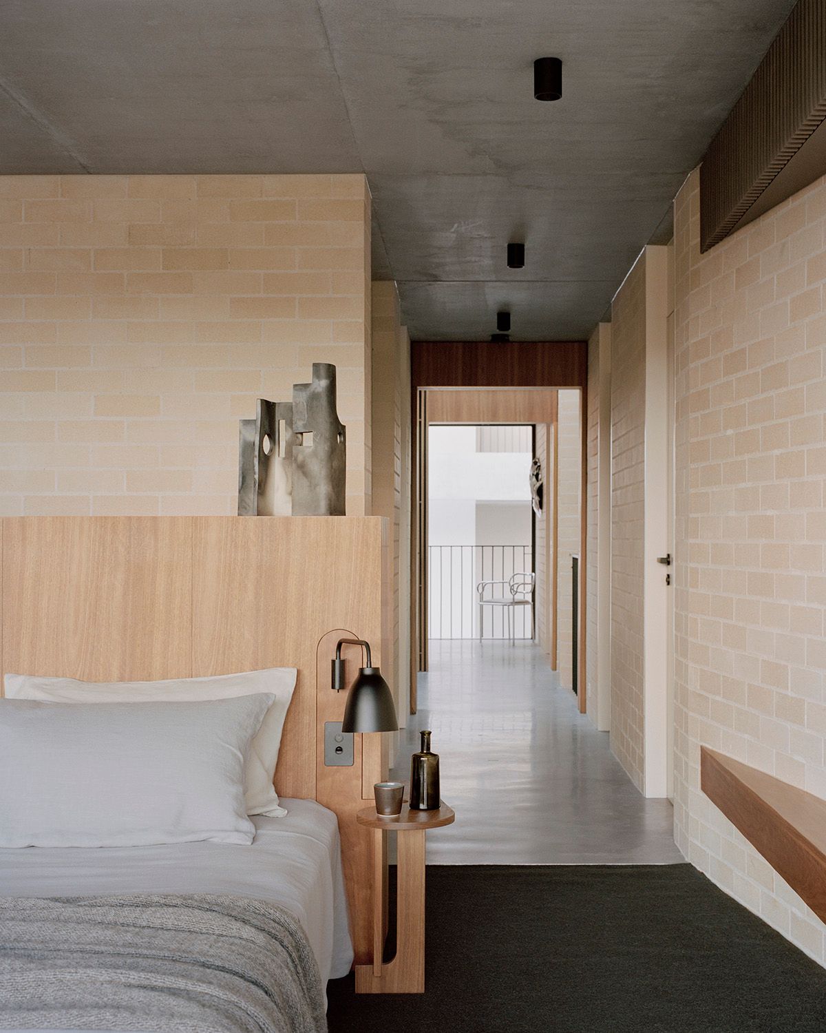 Bronte House by Tribe Studio Architects showing interior bedroom view of timber veneer bed head