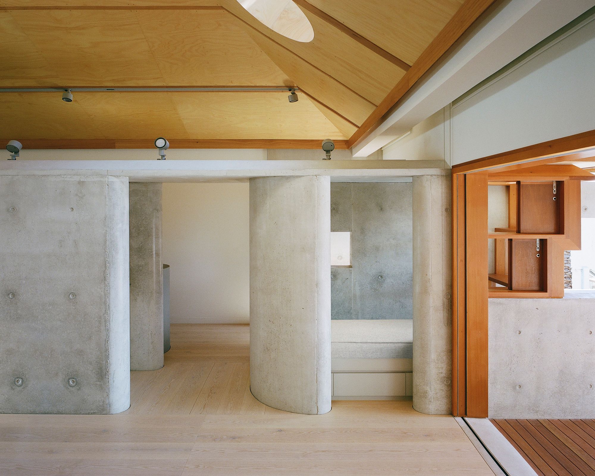 Lee House by Candalepas Associates. Interior,featuring the material composition of timber, and concrete.