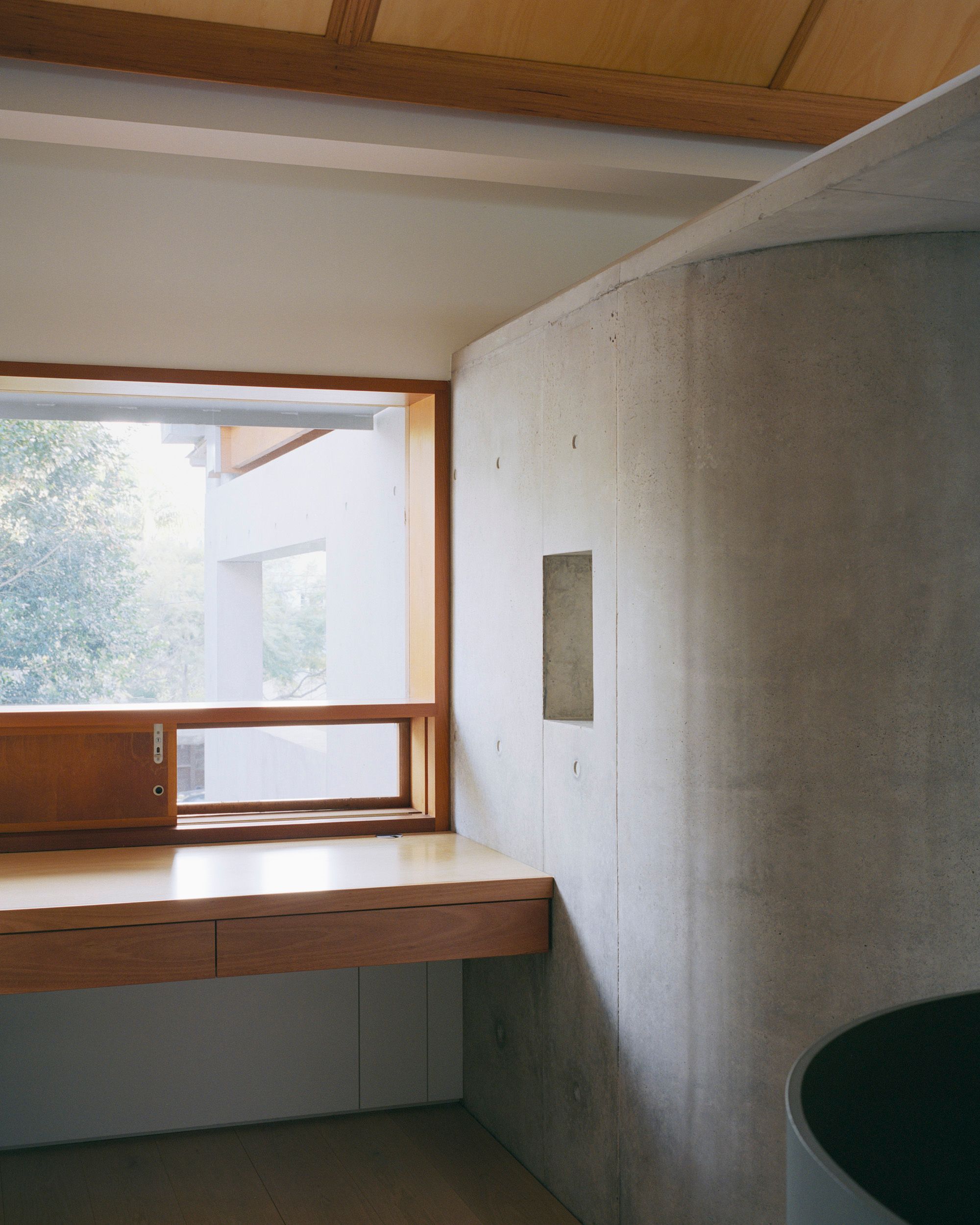 Lee House by Candalepas Associates. Desk view looking out form window to courtyard. 