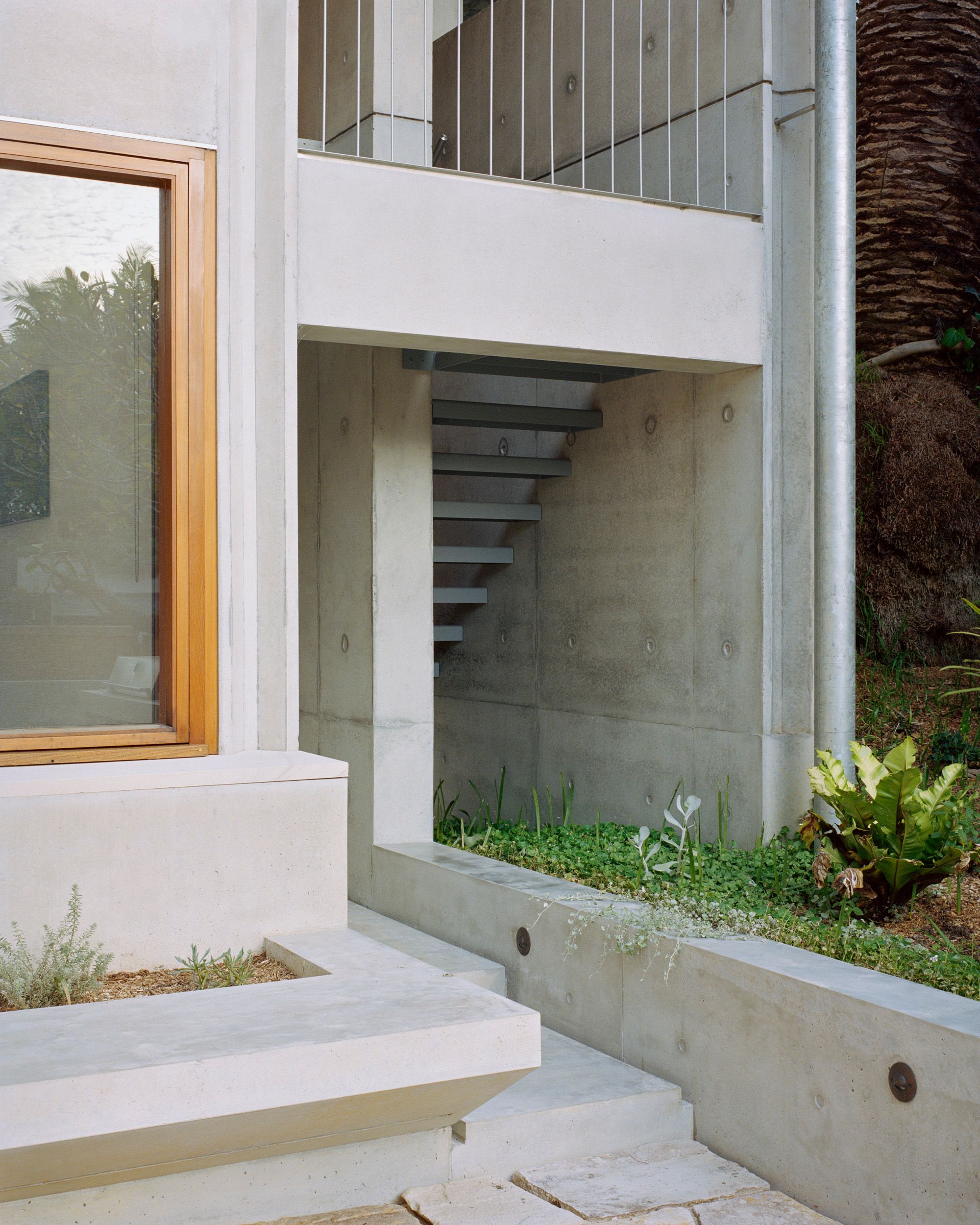 Lee House by Candalepas Associates. Detailed view of rear extension, steps down to courtyard. 