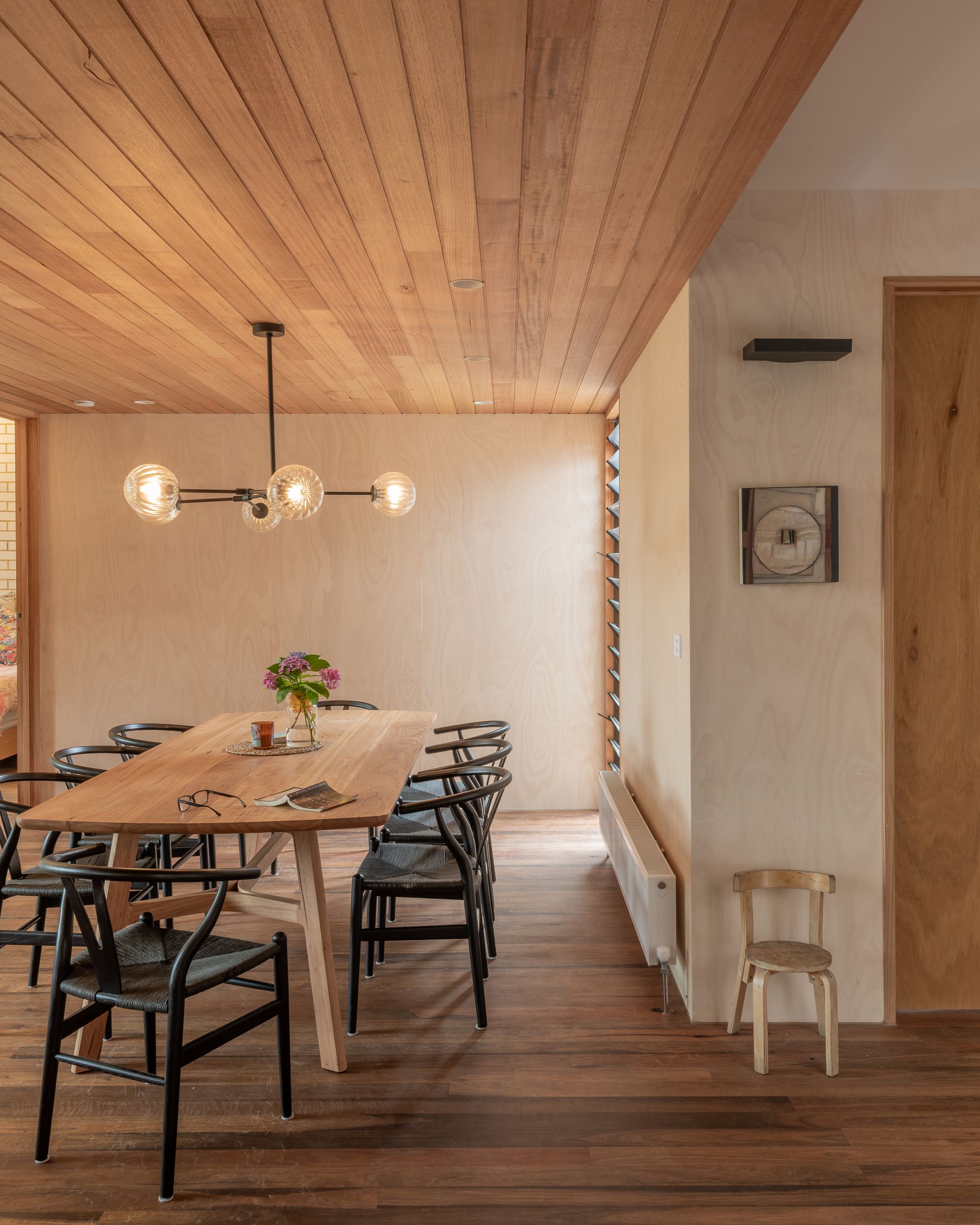 Pinnell-Long House by Harrison & White Architects. View of dining living space with the use of warm timbers