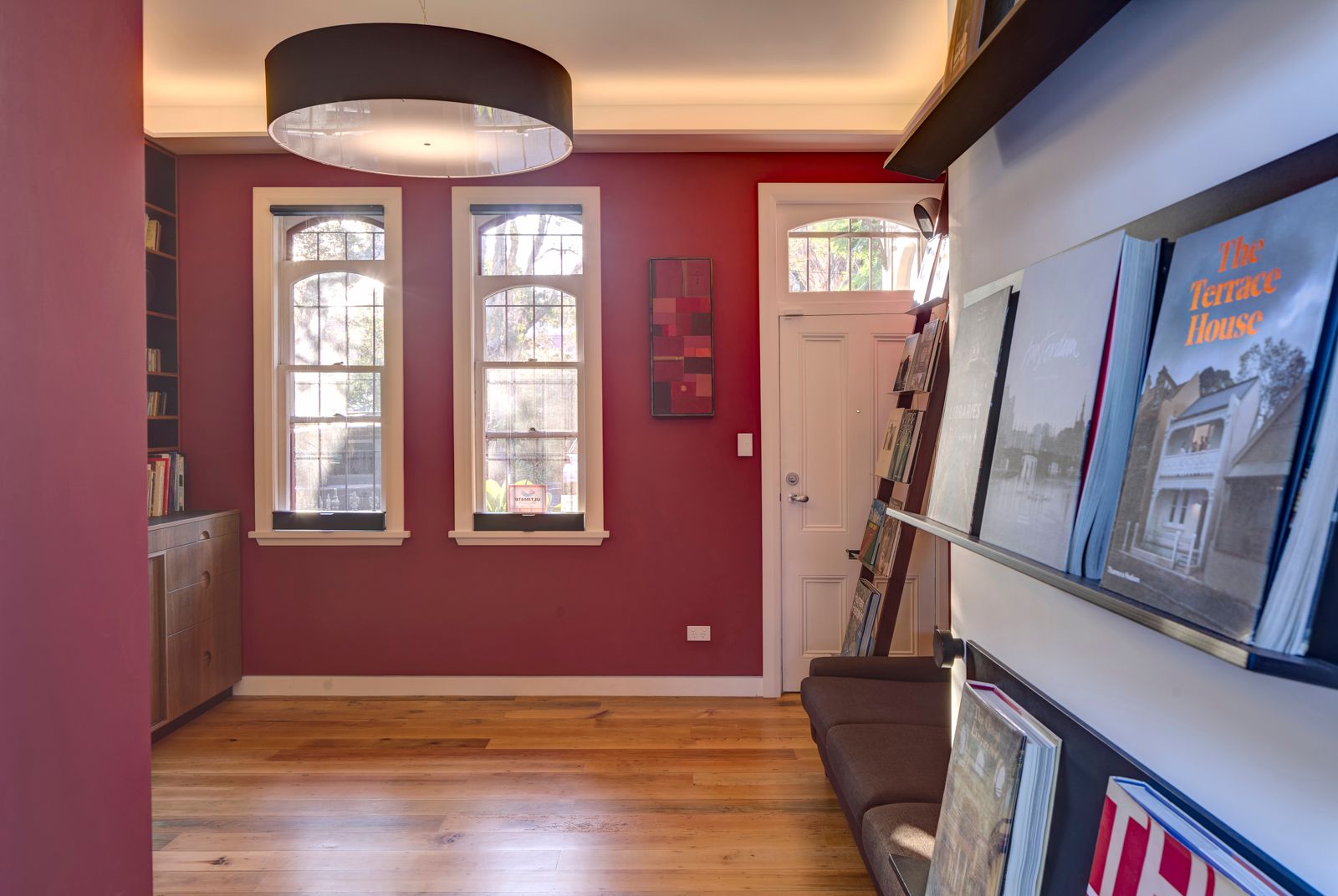 Sky House by Marra+Yeh Architects showing entry door and red room