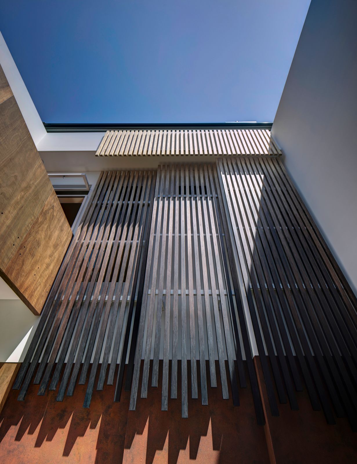 Sky House by Marra+Yeh Architects with timber screen feature in void space