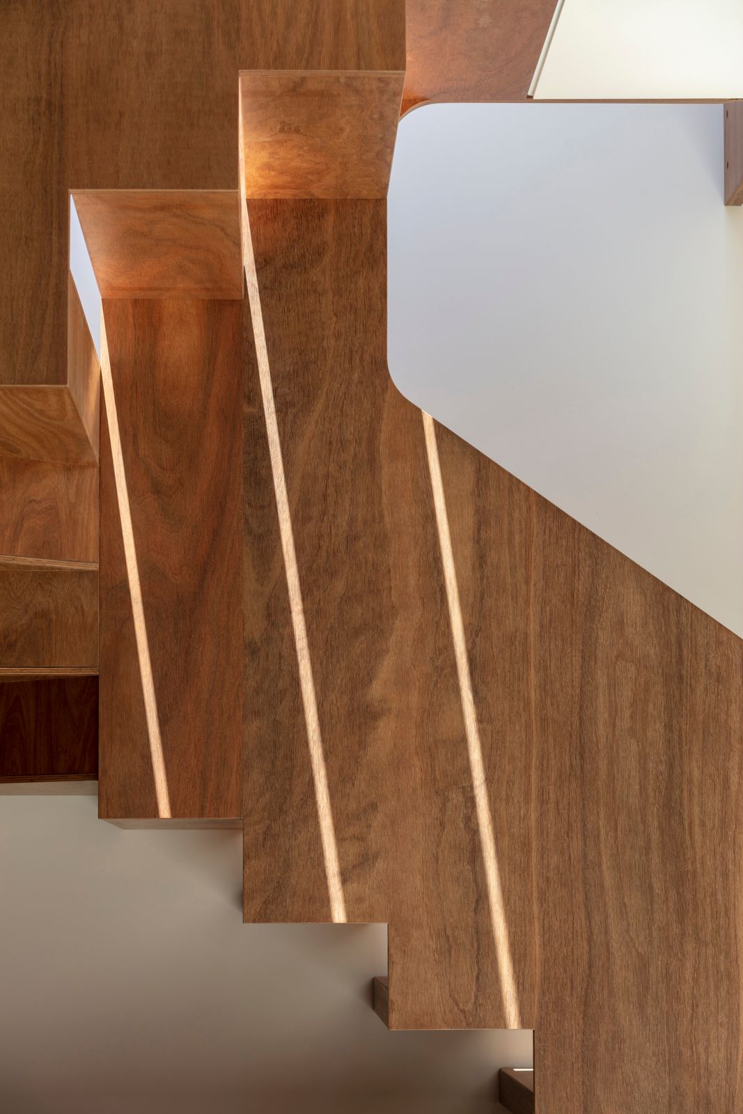 Sky House by Marra+Yeh Architects showing shadow play on feature stair