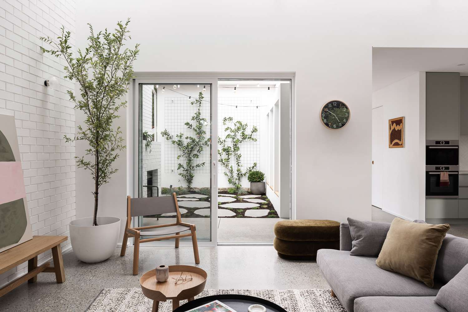 The Third by Dalecki Design showing living space looking out to garden courtyard