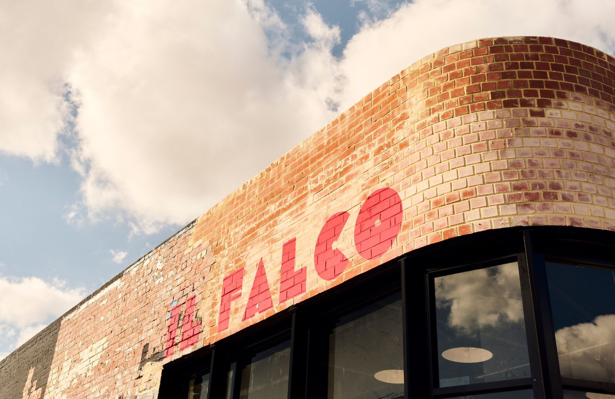 Il Falco Pizza by work.shop.dine Design Studio showing brick facade
