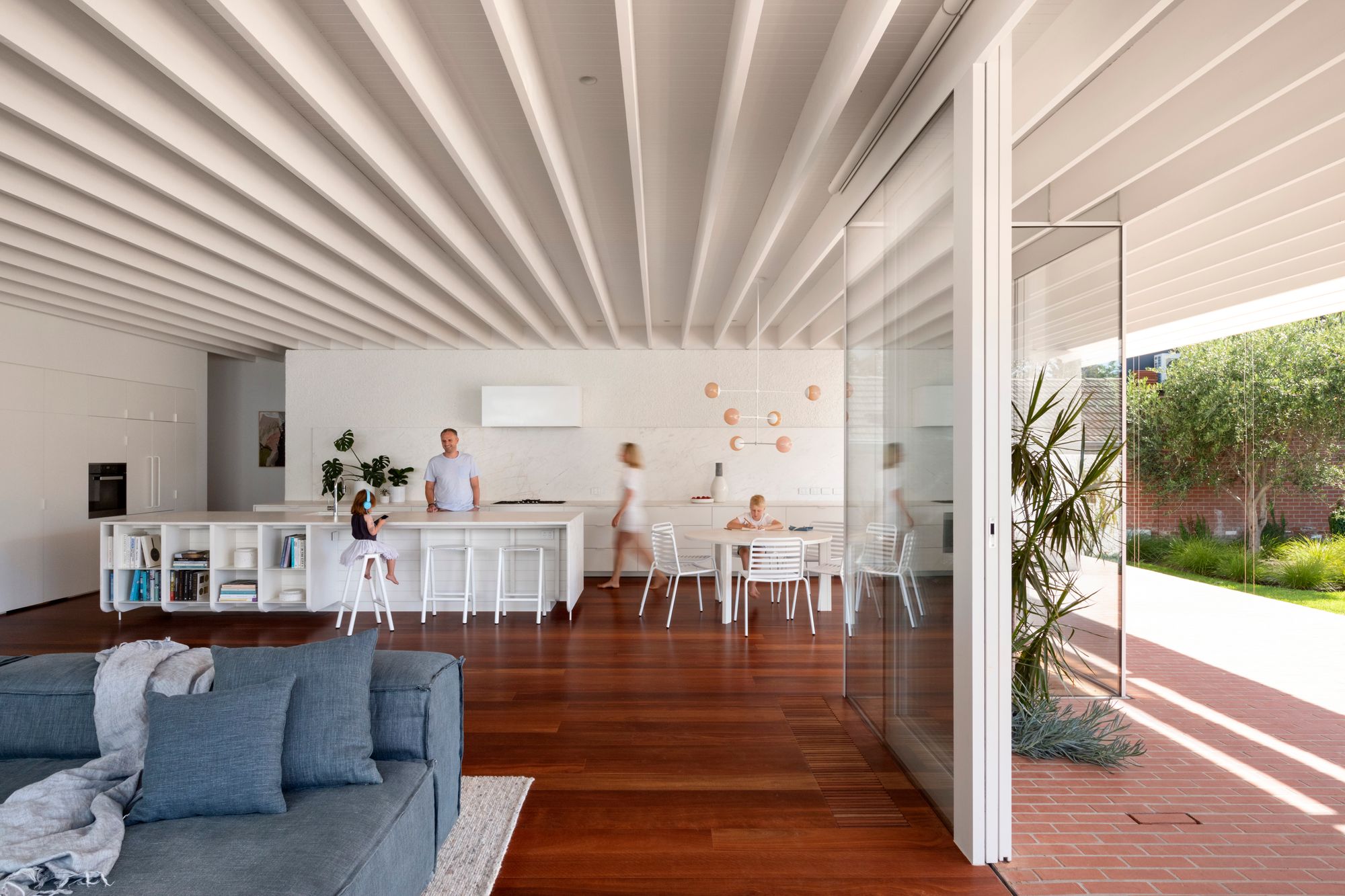 Elwood House by AM Architecture showing interior of new living spaces with exposed beams