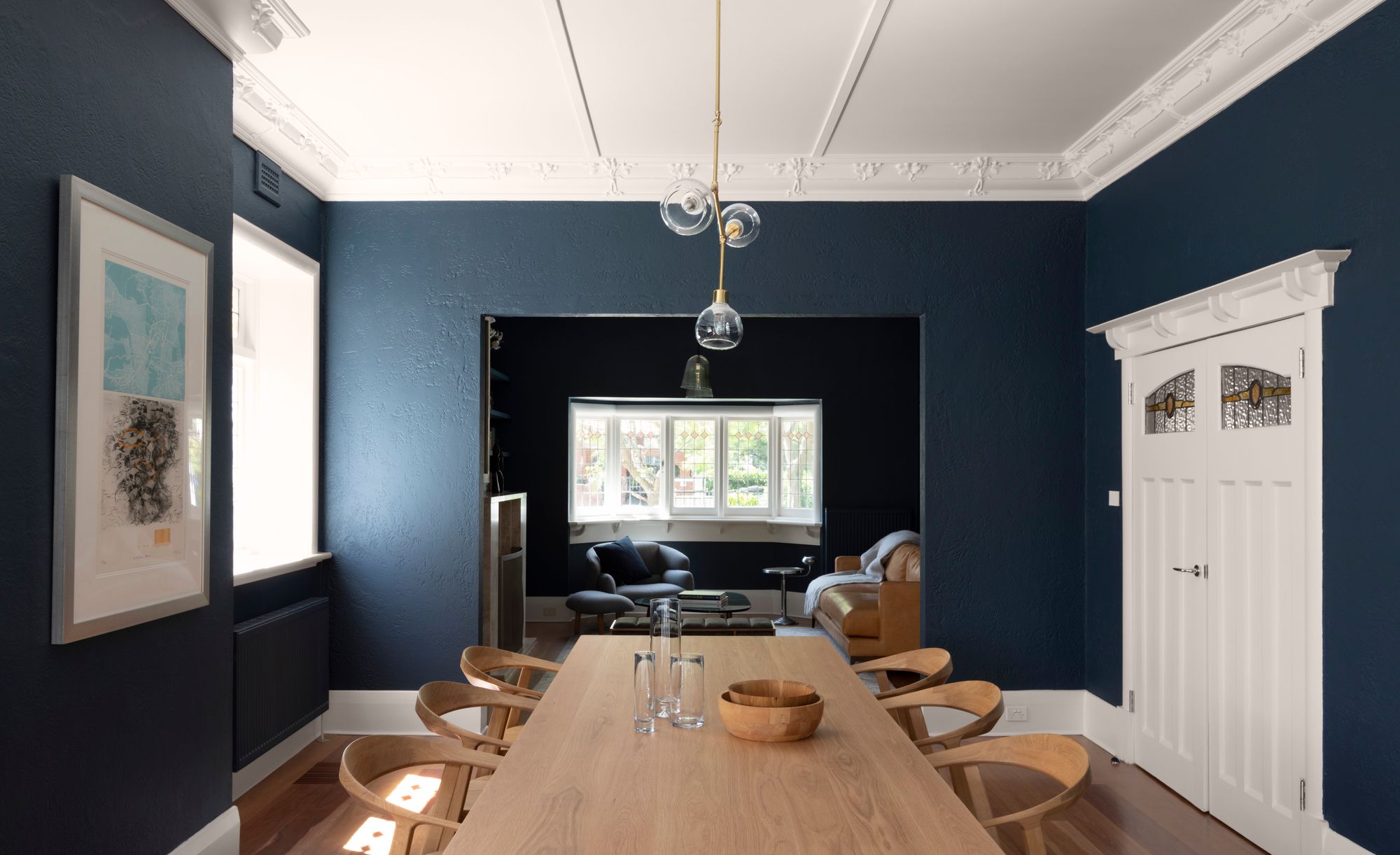 Elwood House by AM Architecture showing refurbished existing spaces with a dark blue paint colour