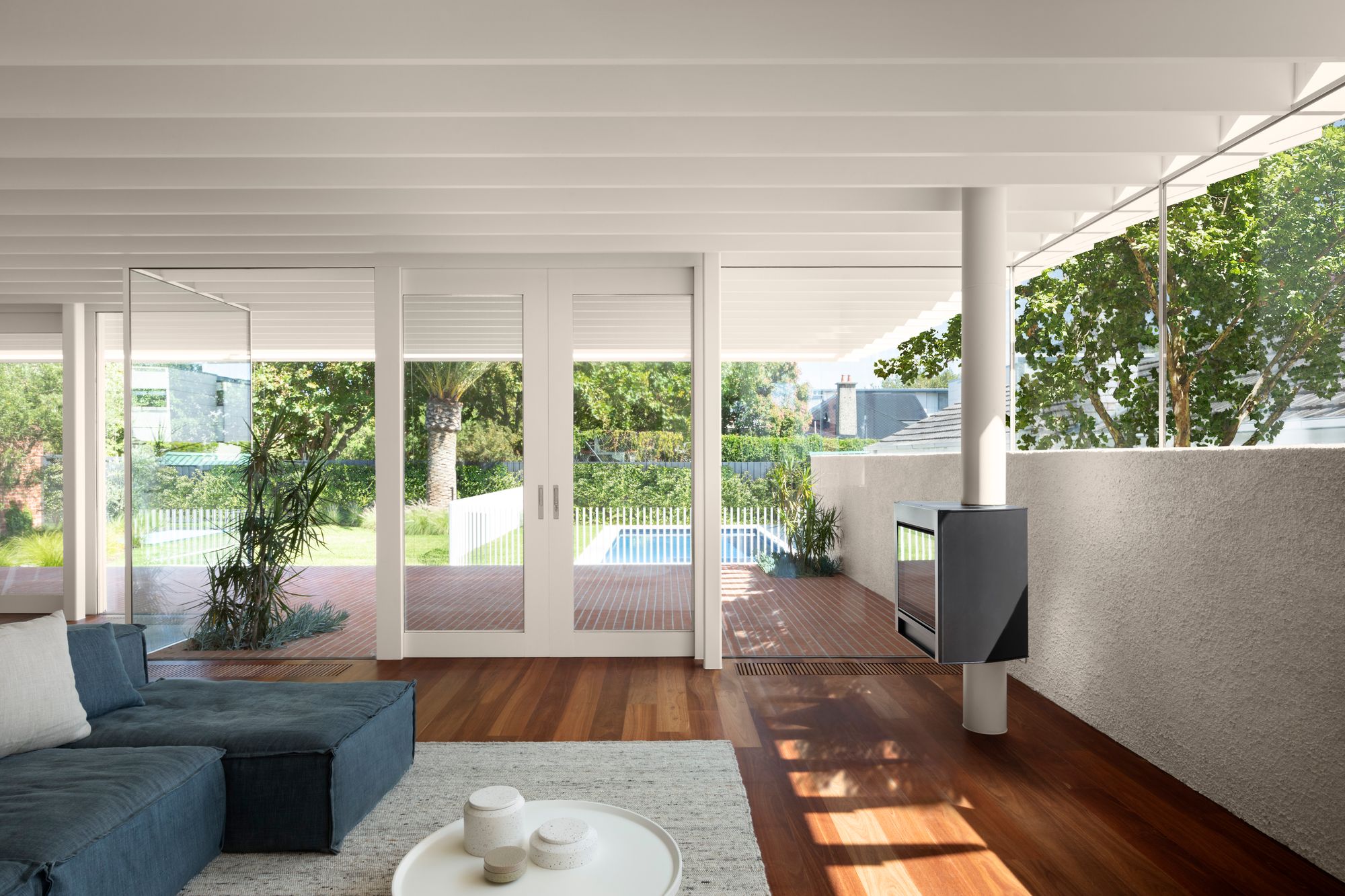 Elwood House by AM Architecture showing interior of living space and showing how it connects to the backyard