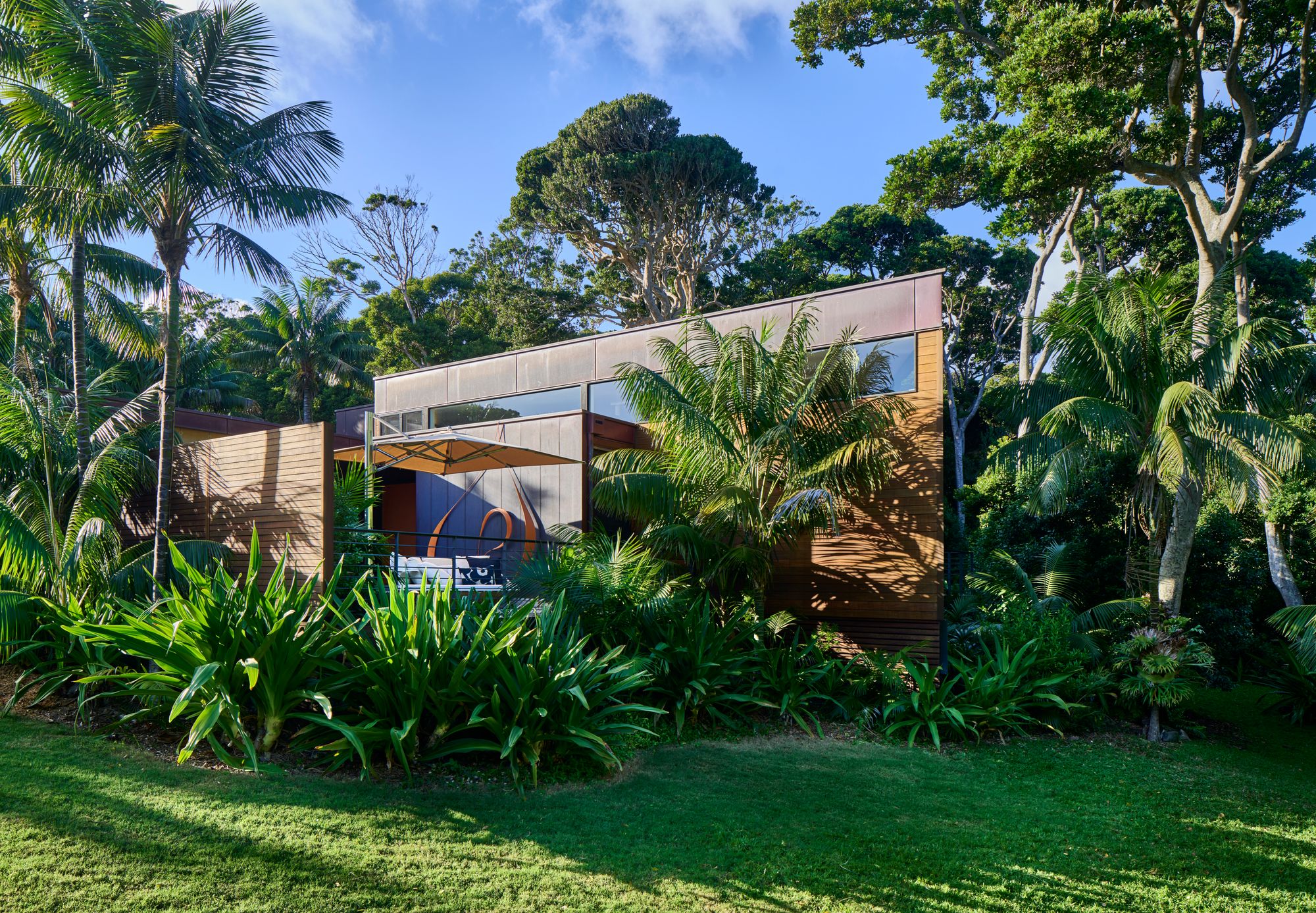 Island House, Lord Howe Island showing exterior of building located in tropical garden