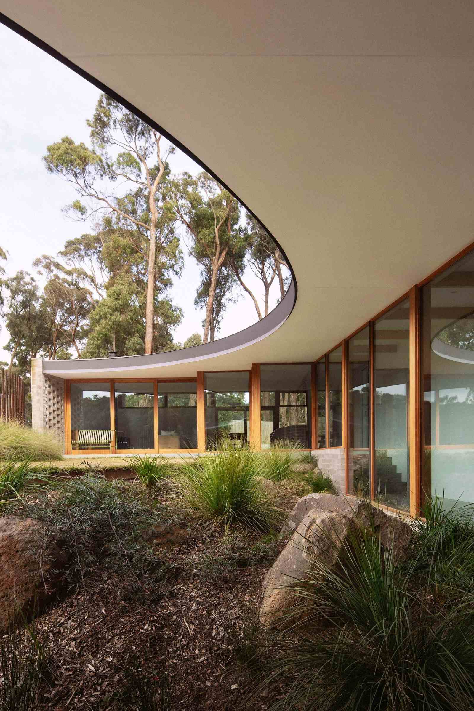 Brown Hill House by Eldridge Anderson showing native garden with rock outcrops and grasses