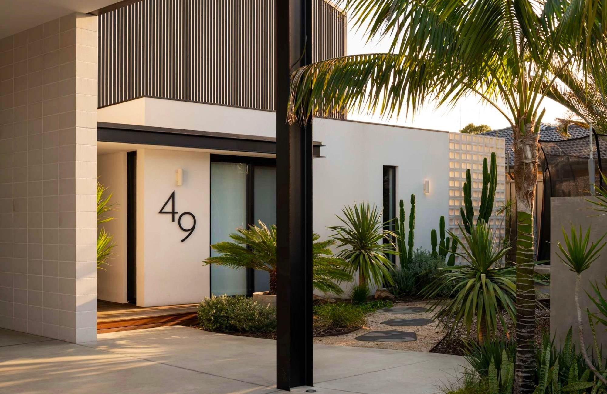 The Boatshed by Dalecki Design showing cacti garden in the front yard of a residential design