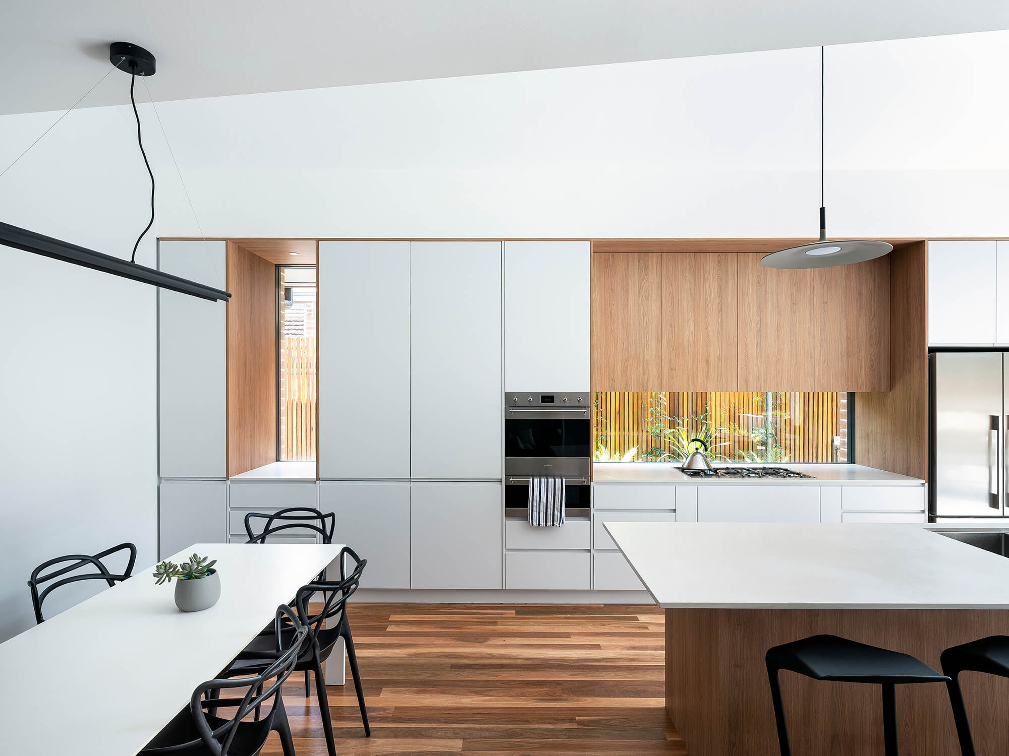 Stealth House by Bijl Architecture. Kitchen and dinging area.