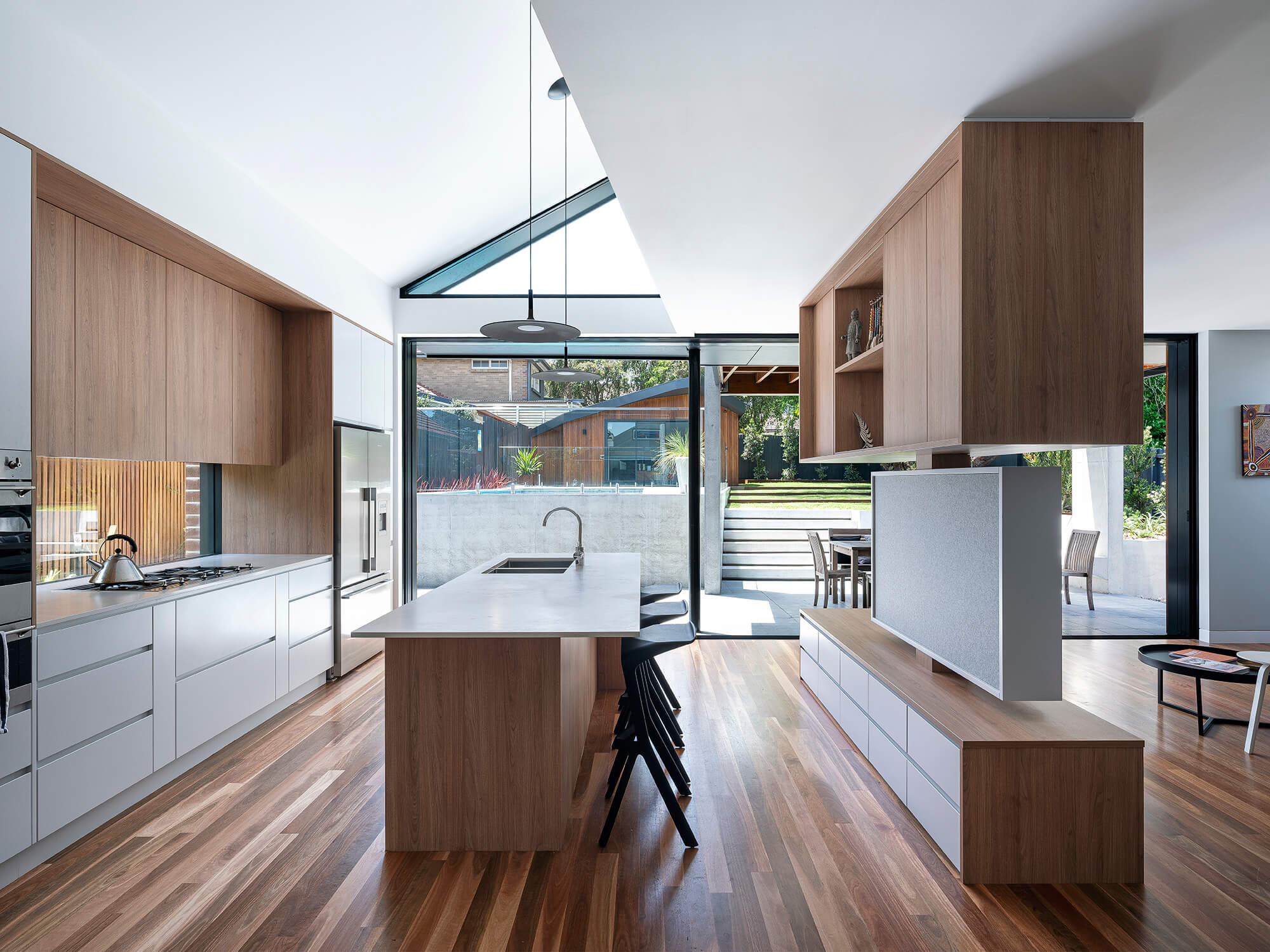 Stealth House by Bijl Architecture. Kitchen and living room area. 