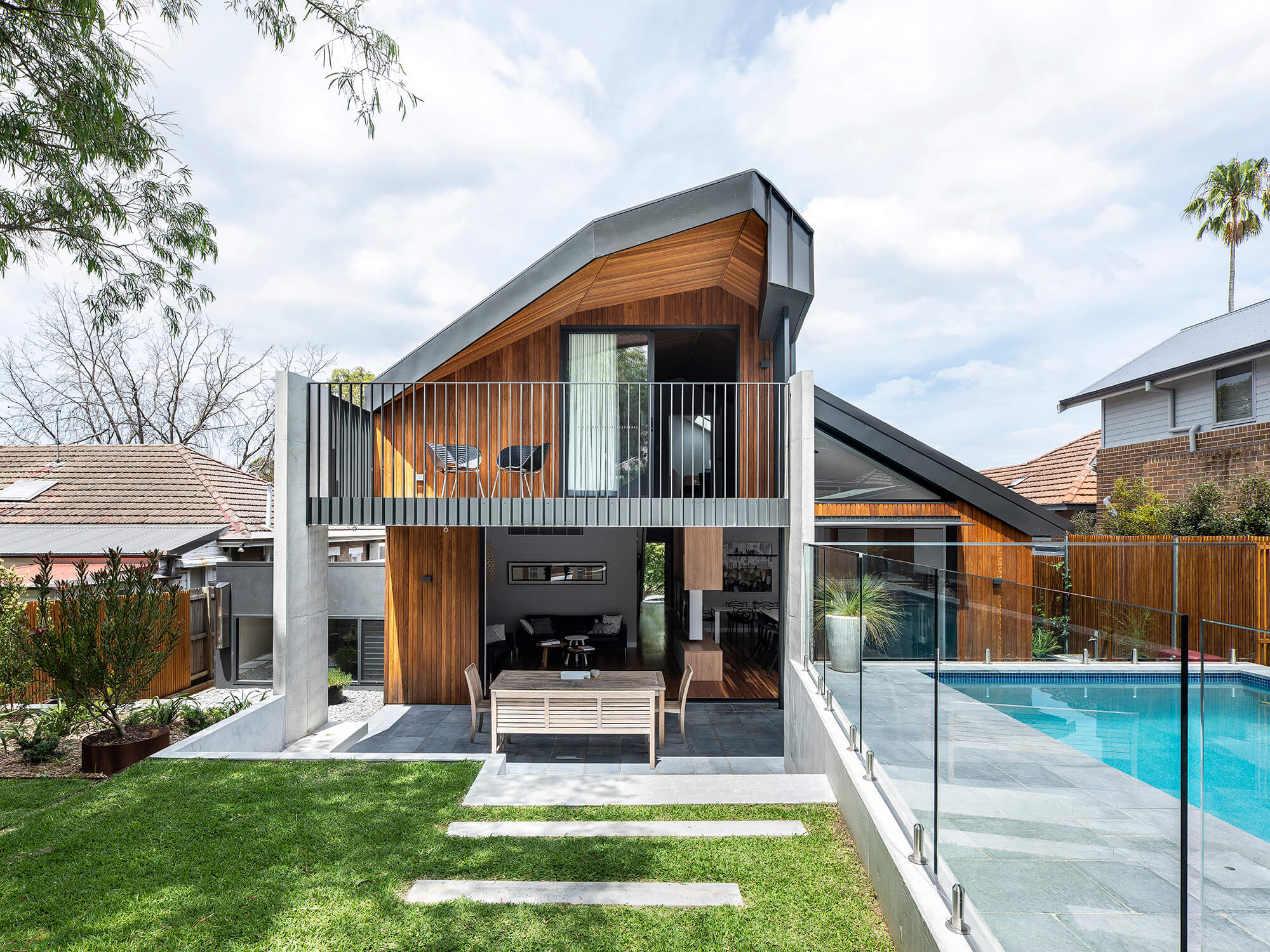 Stealth House by Bijl Architecture. Rear façade view, outdoor entertainment space.
