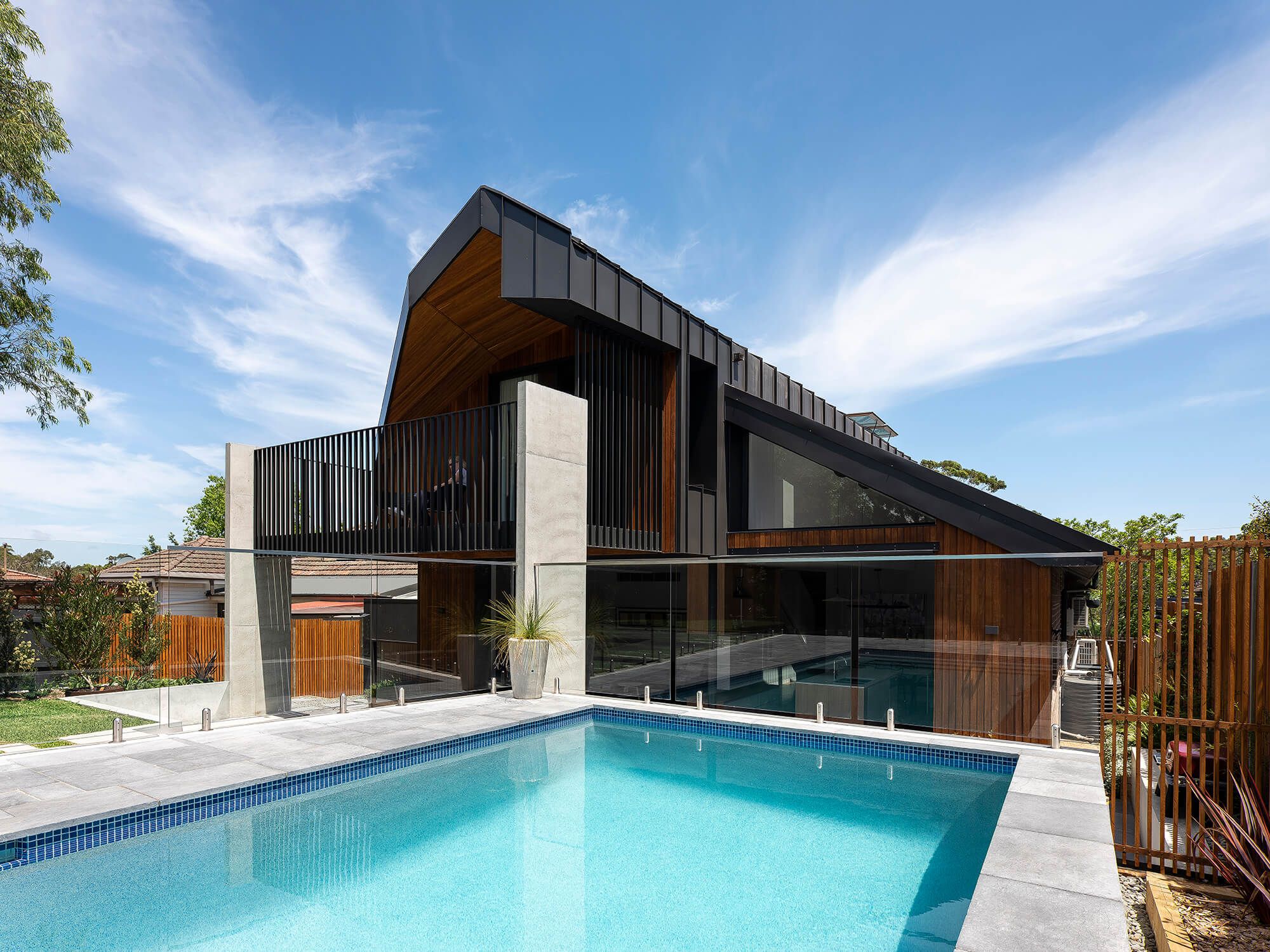 Stealth House by Bijl Architecture. View of rear extention from pool area.