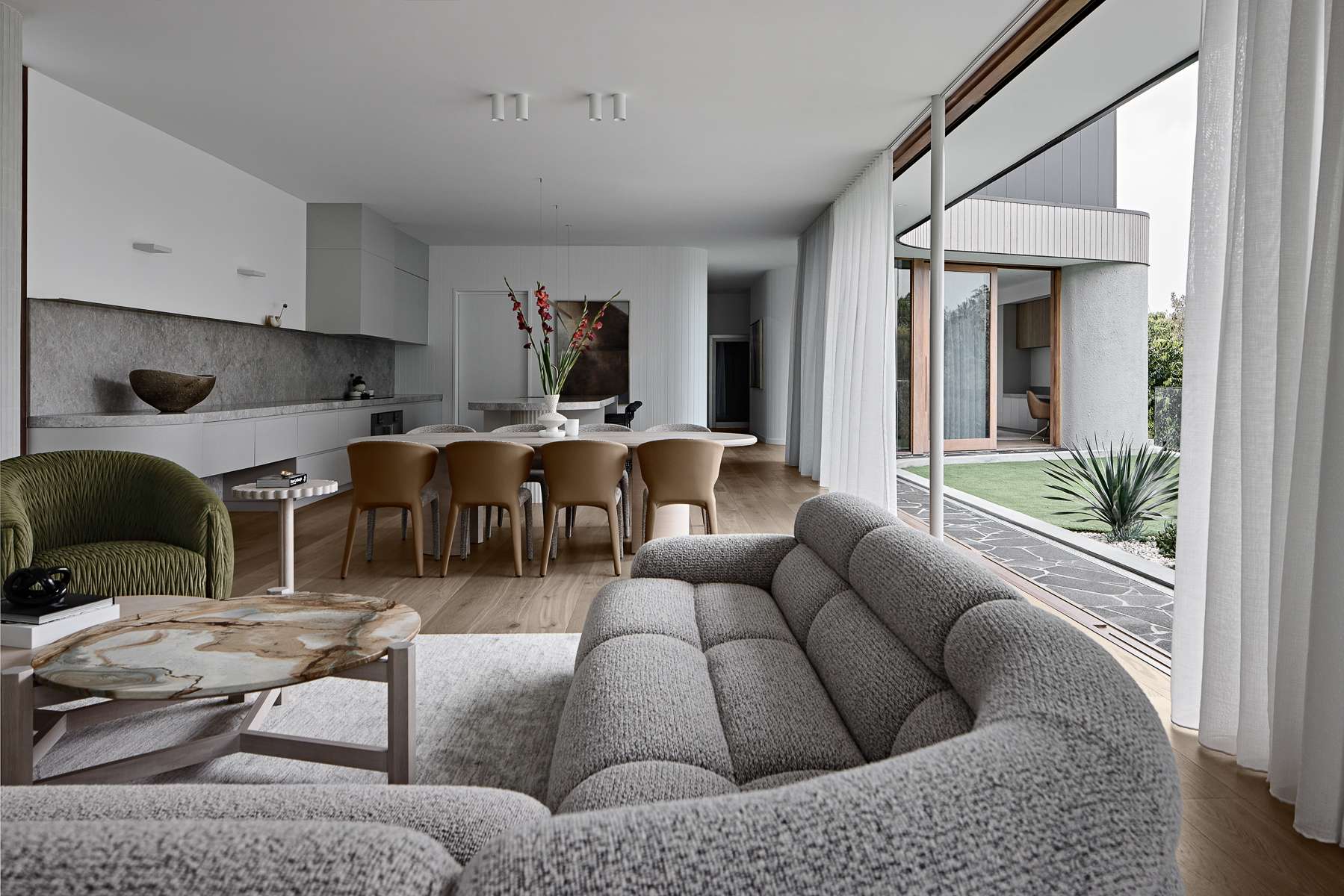 Amiri Courtyard House by Kelder Architects showing interior view of living and dining areas