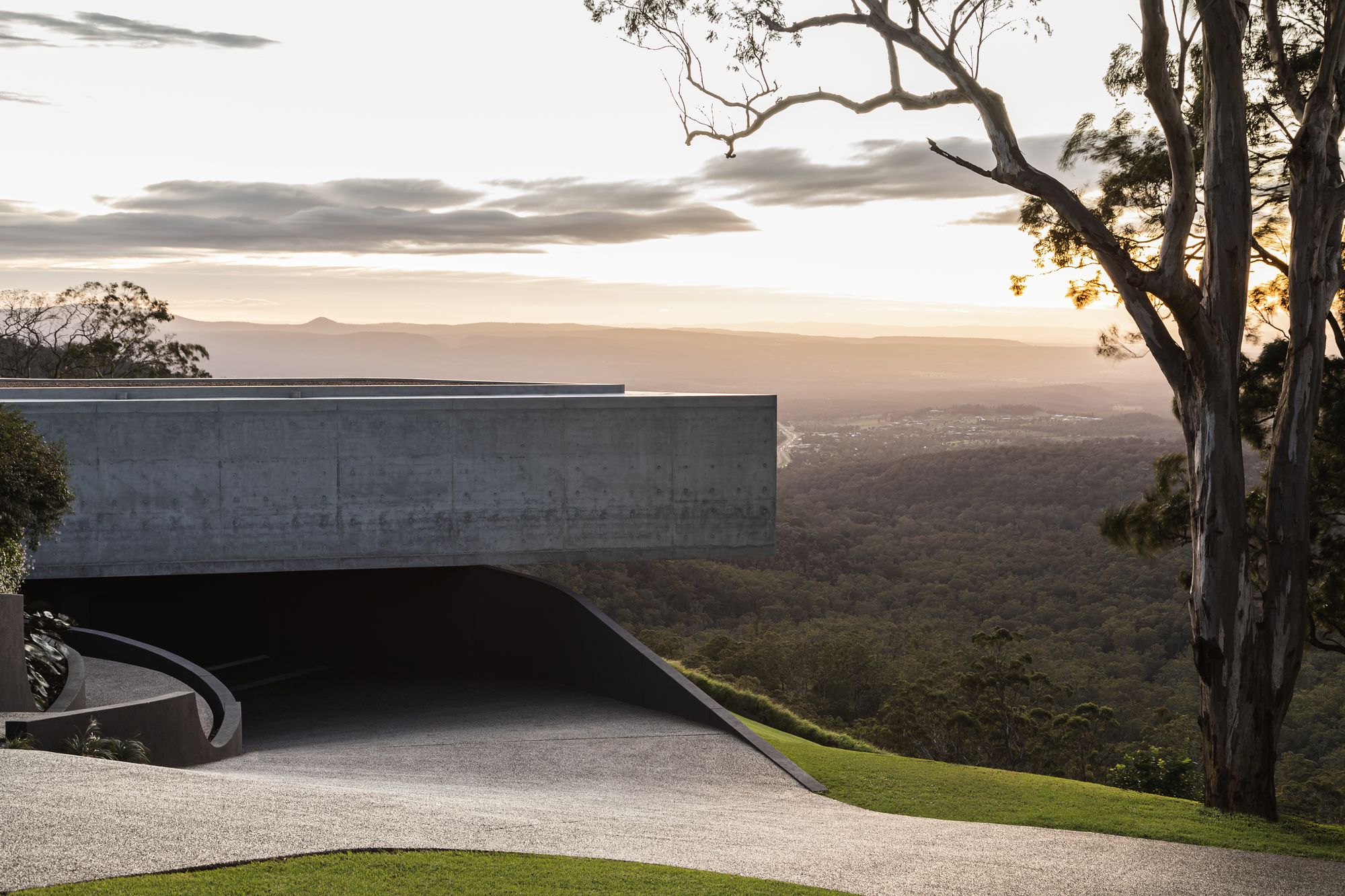 Cliffhanger by Joe Adsett Architects showing the concrete elevation and driveway