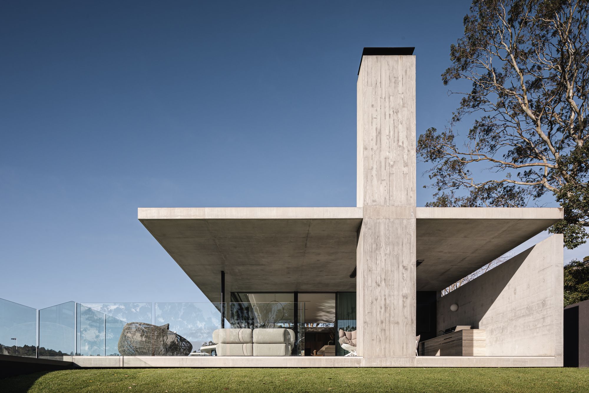 Cliffhanger by Joe Adsett Architects showing the side elevation and the concrete chimney