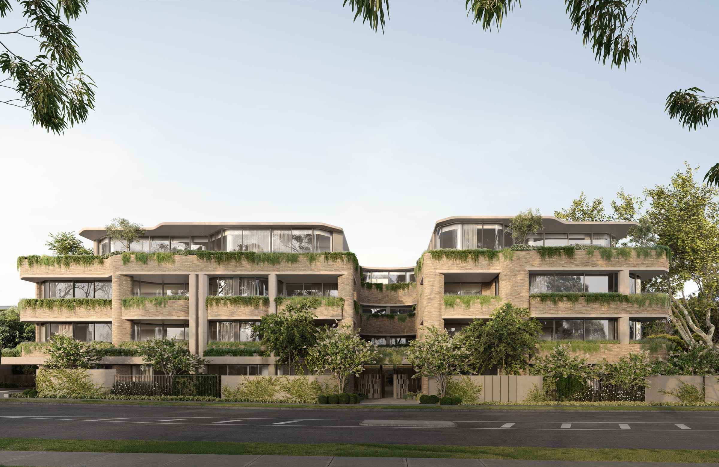 Como, Toorak by Prime Edition.Exterior view of a modern residential complex with multiple levels. The architecture incorporates organic elements, with greenery draping over the balconies of each unit. The building is structured with clean lines and rectangular forms, offering a harmonious blend with the natural surroundings.
