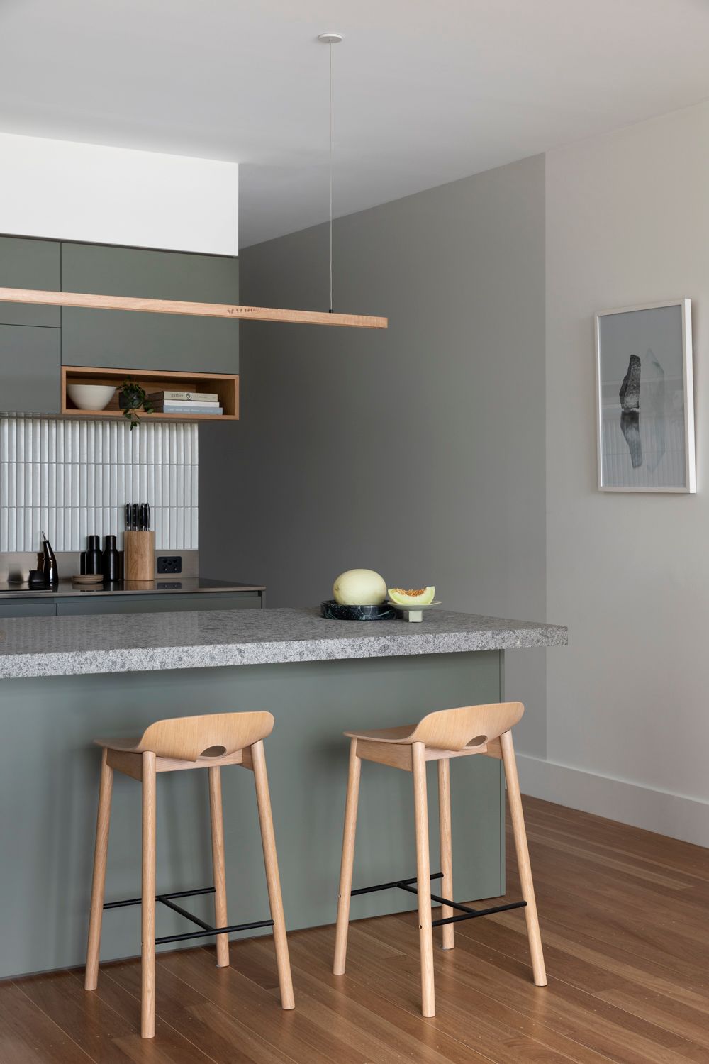 Fluxwood Hollow Pendant. Photography by Martina Gemmola. The Hollow is a versatile solid timber pendant. The singular LED strip lighting creates a functional yet statement light source that is perfect over kitchen islands and workspaces like it is positioned in this setting above kitchen island bench 