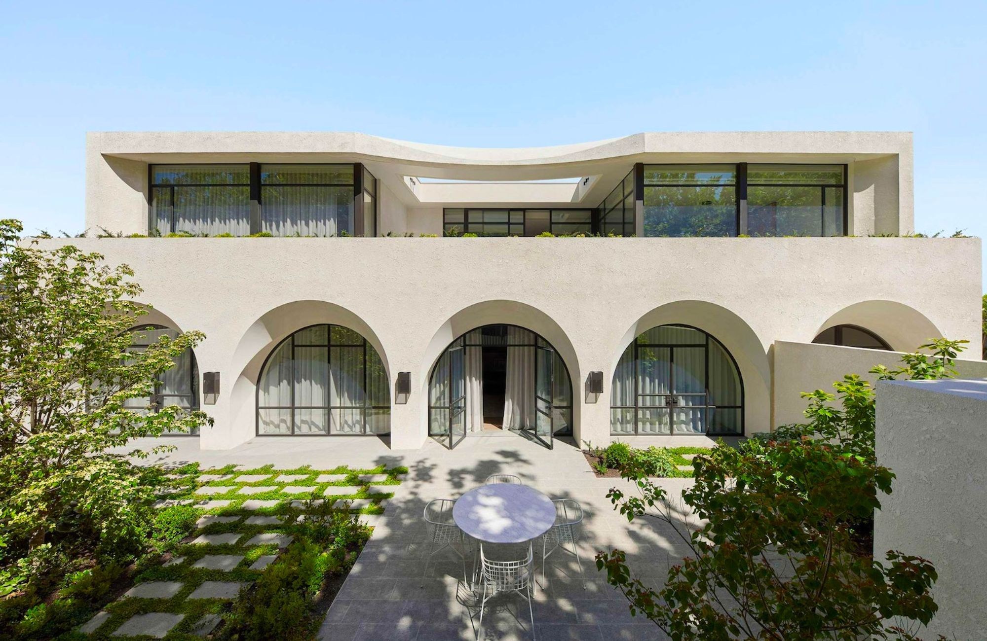 Huntington Tower Road by Jolson showing white render exterior and arch windows and doors