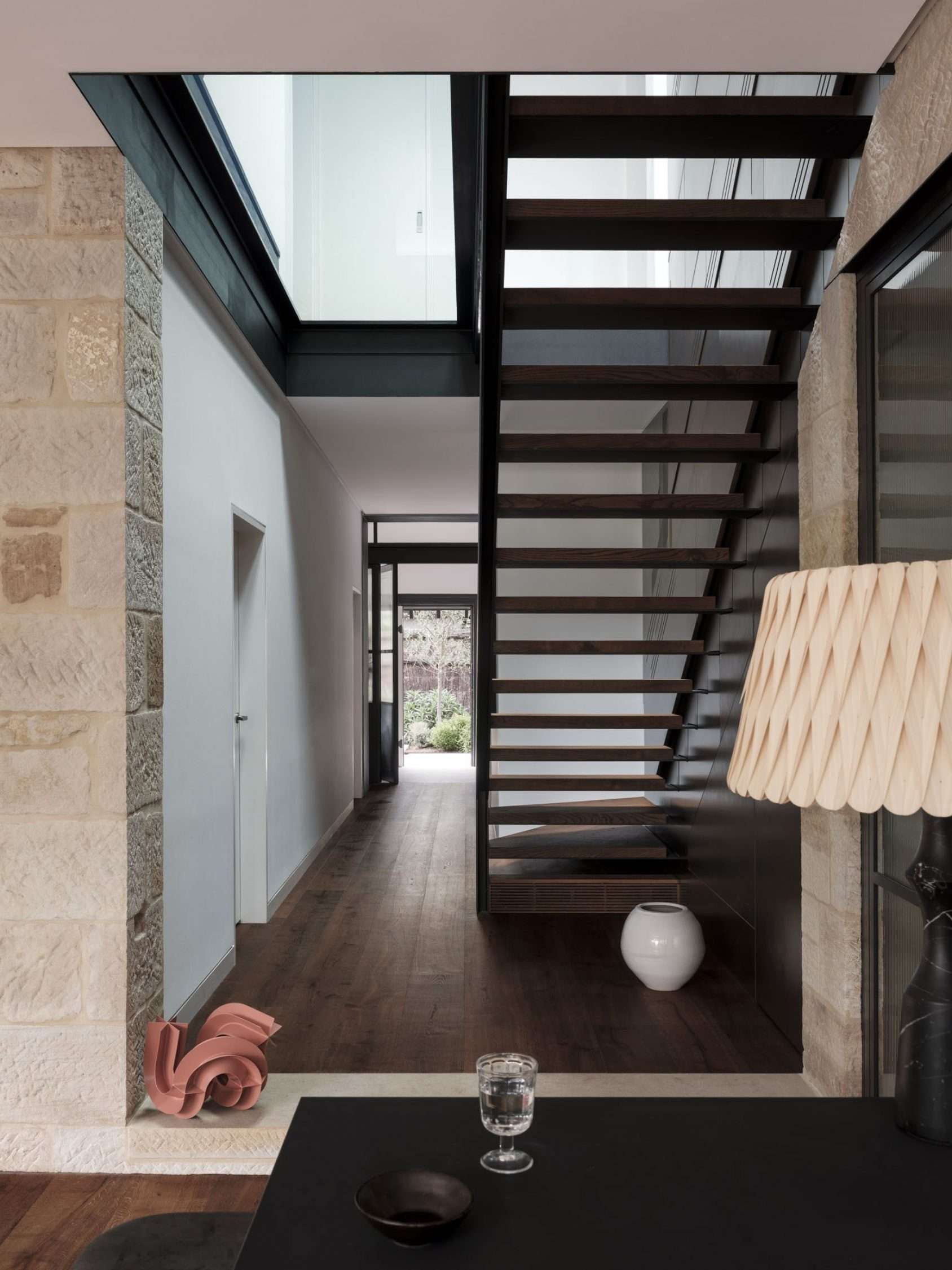 Maranatha House by BIJL Architecture showing the hallway and feature staircase
