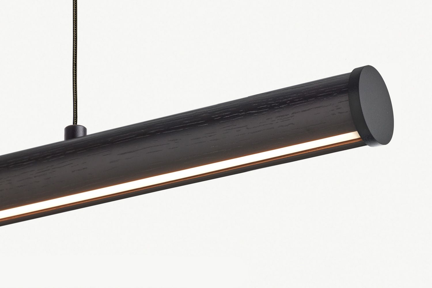 Fluxwood Roller Black Pendant. The Roller is a classic dowel pendant with a subtle curved edge to catch the LED light and create a unique gradient effect. 