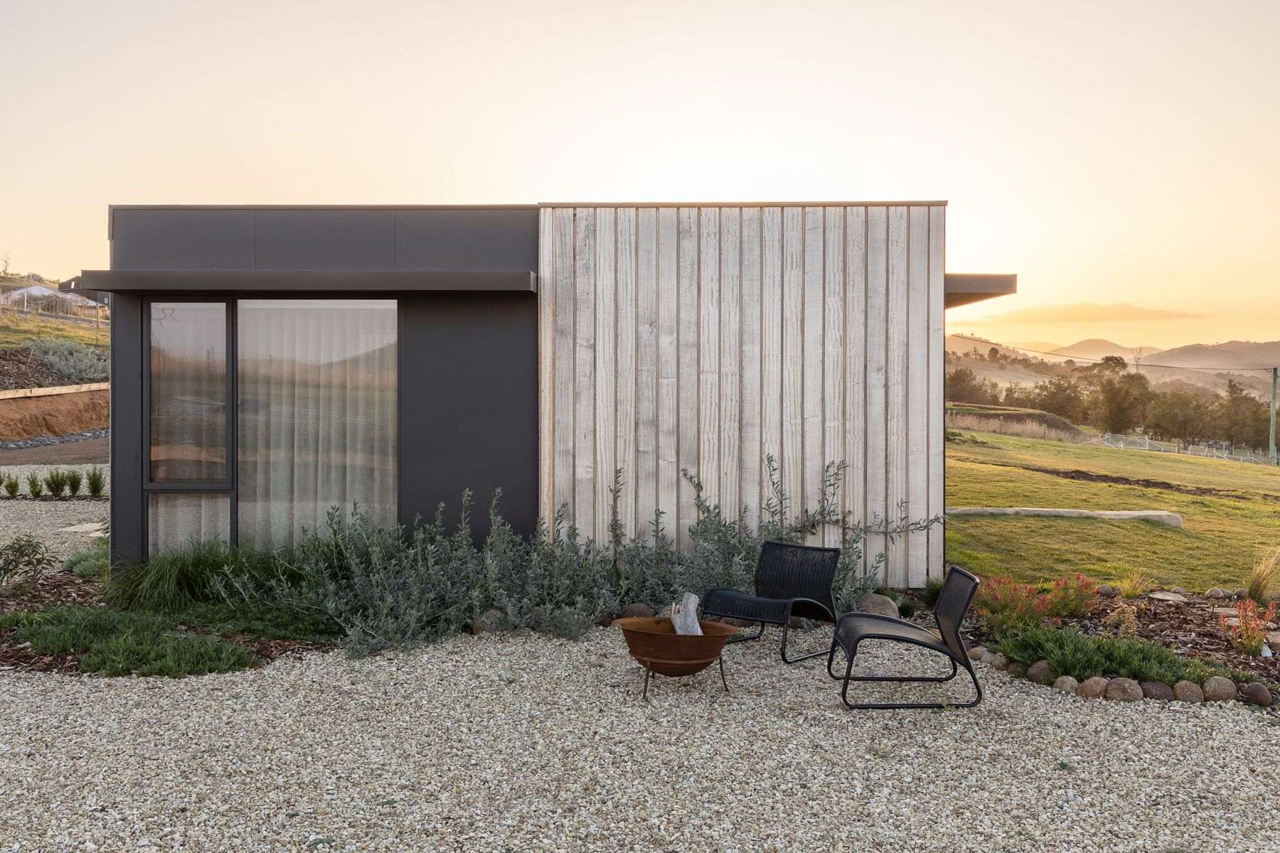 We Ponder House by Saxon Hall Architecture with Align Architecture showing the side elevation and the tasmanian oak cladding