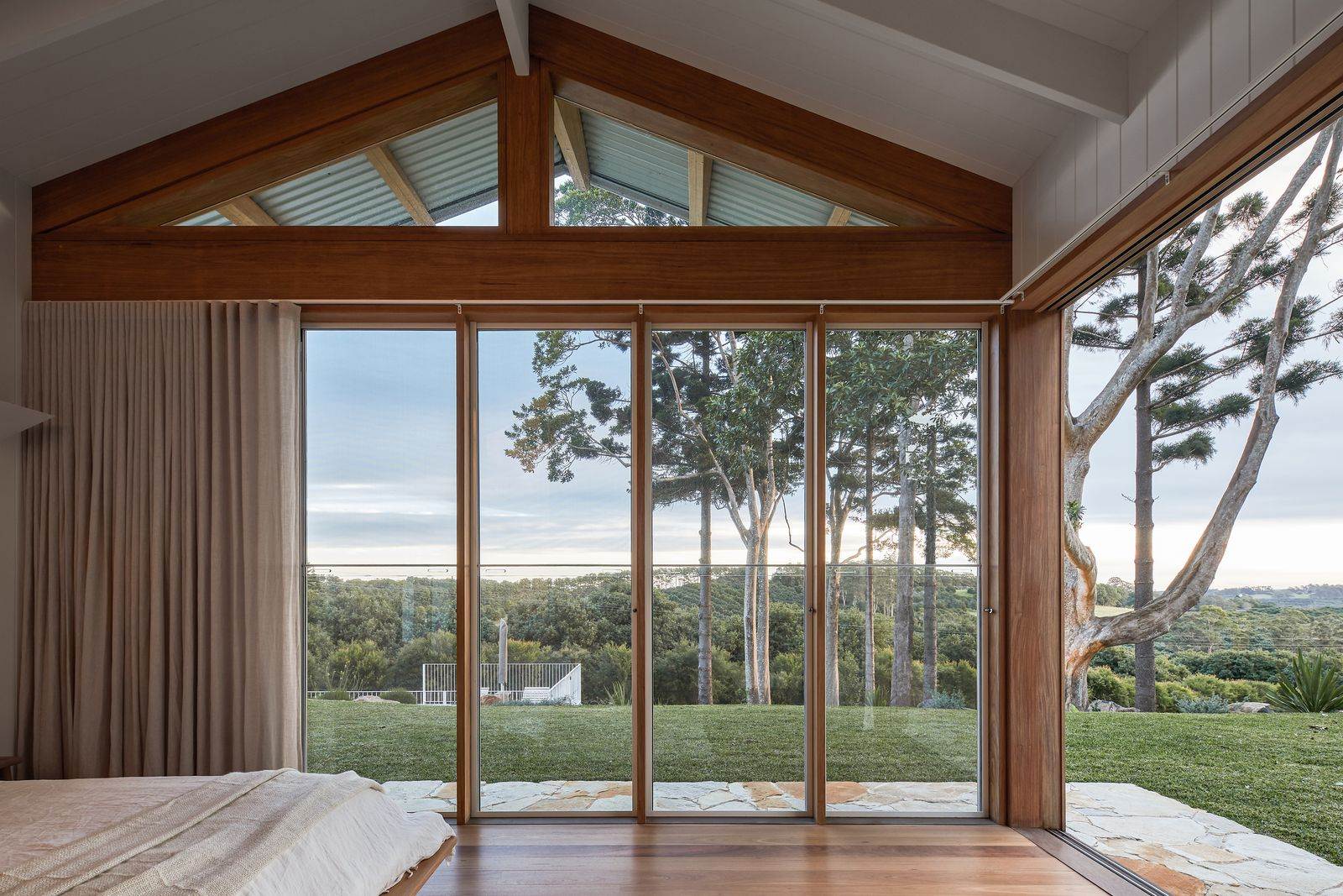 The Caretaker's by Aphora Architecture showing the view out from the bedroom