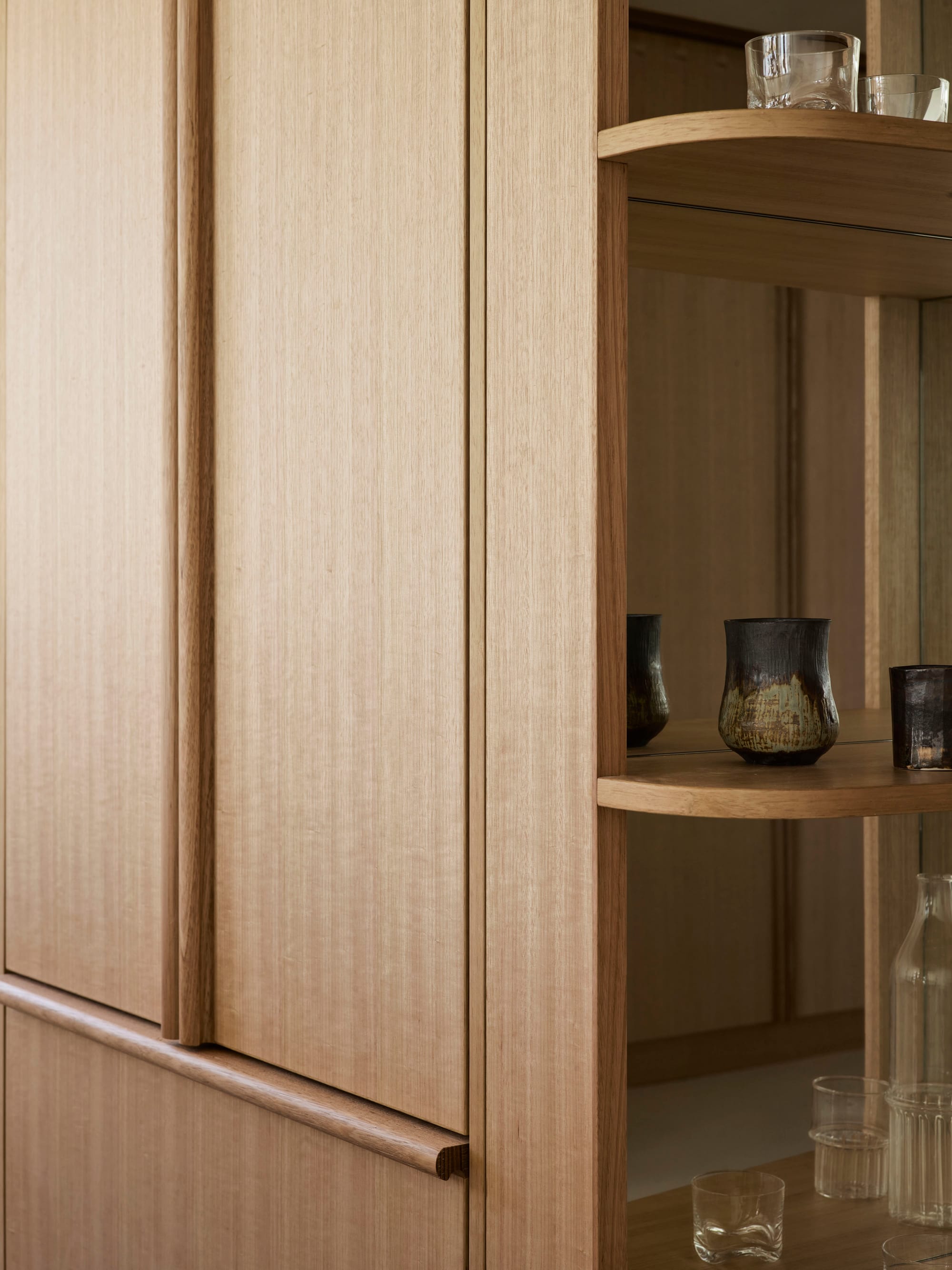 A detail shot of the Tasmanian timber veneer joinery in this modern apartment design by Studio ZAWA