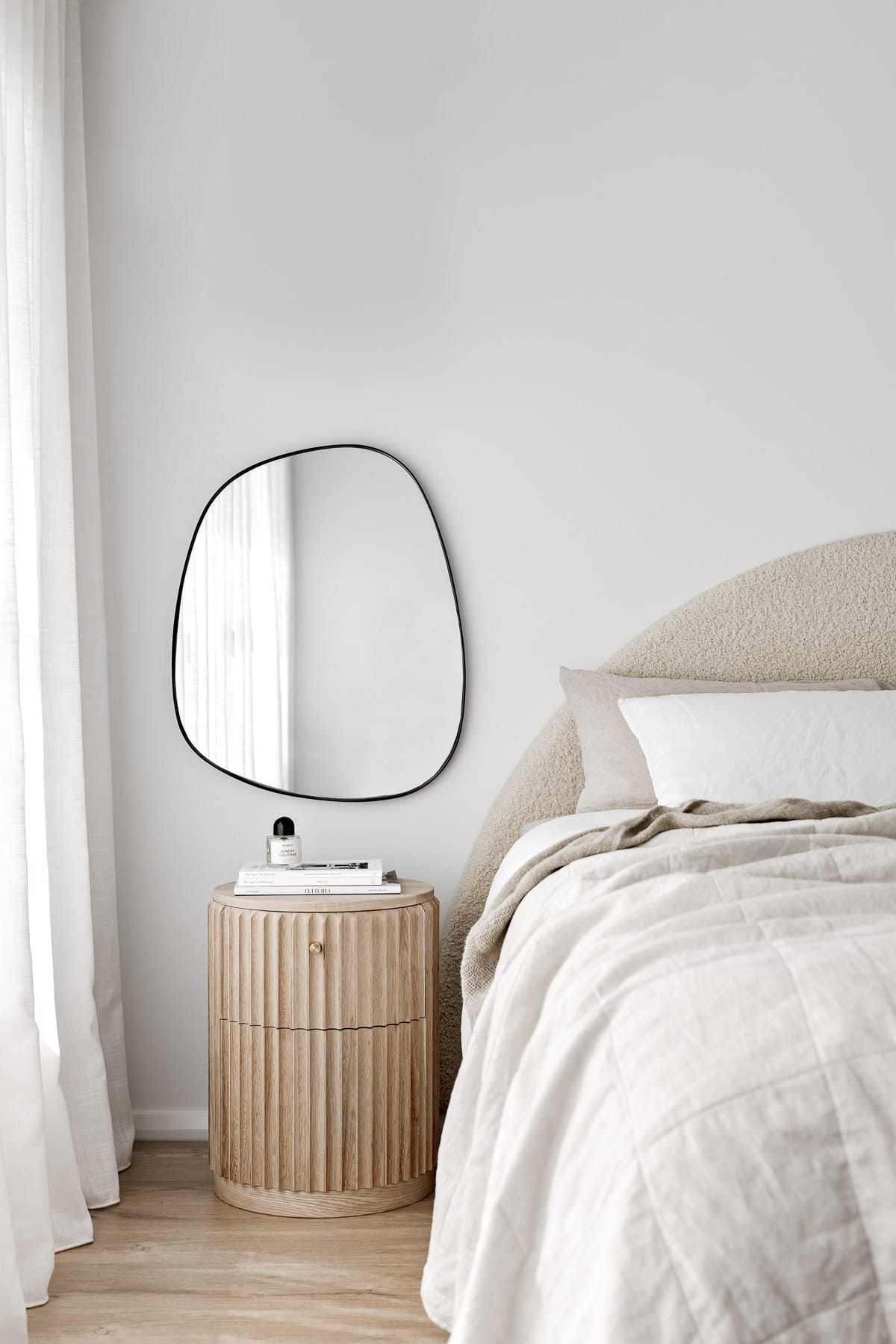Showing the Underline Bedside Table by Hegi Design House styled in a bedroom