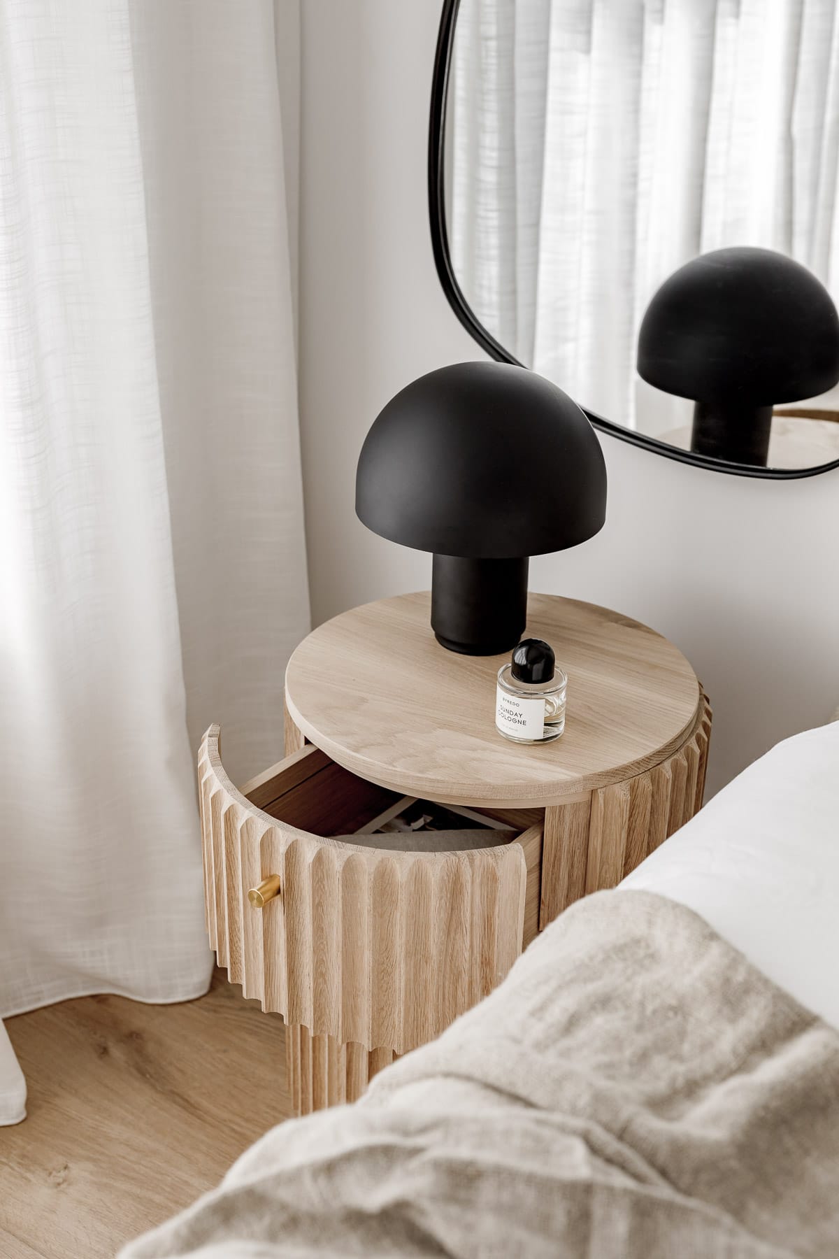 Detail shot of the Underline Bedside Table by Hegi Design House styled in a bedroom with the drawer open