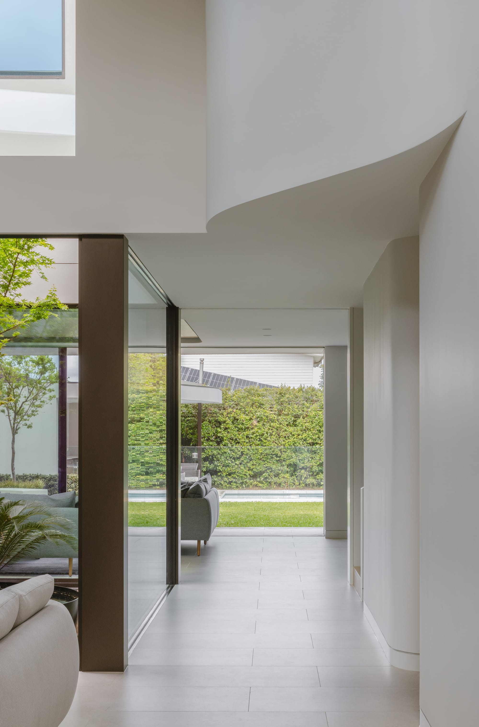 Kenneth Street by Design Studio Group showing the open hallway and the link to the garden courtyard