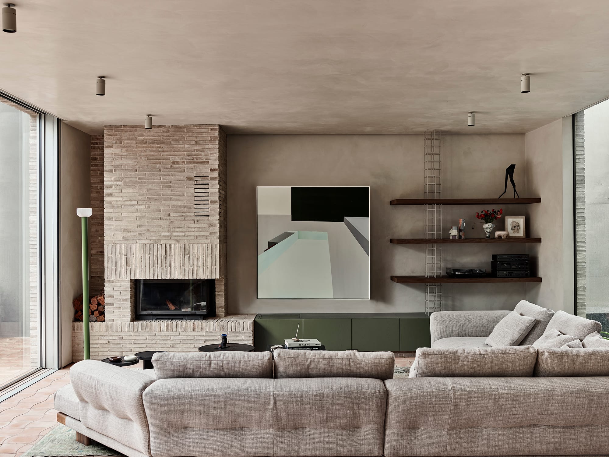 Terra Firma by RobsonRak showing an interior view of the living room with brick fireplace