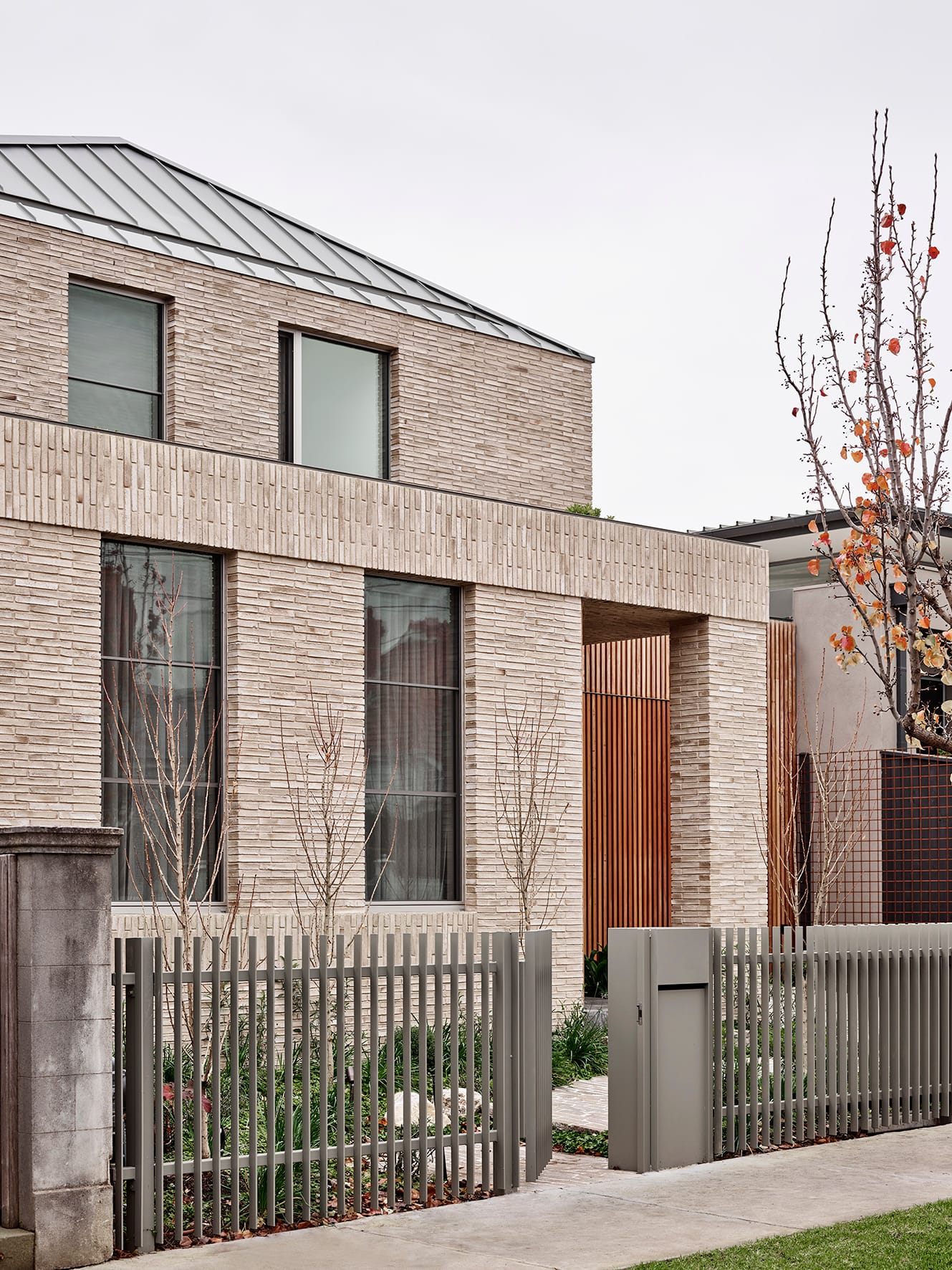 Terra Firma by RobsonRak showing the street facade of this new house showing the thin brickwork