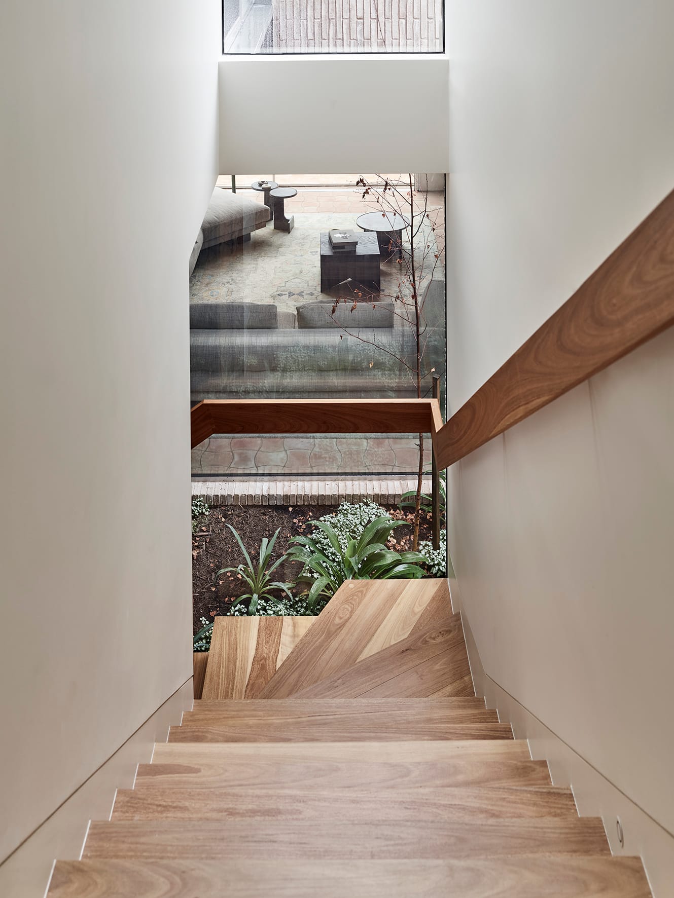 Terra Firma by RobsonRak showing the timber staircase and view to the internal garden