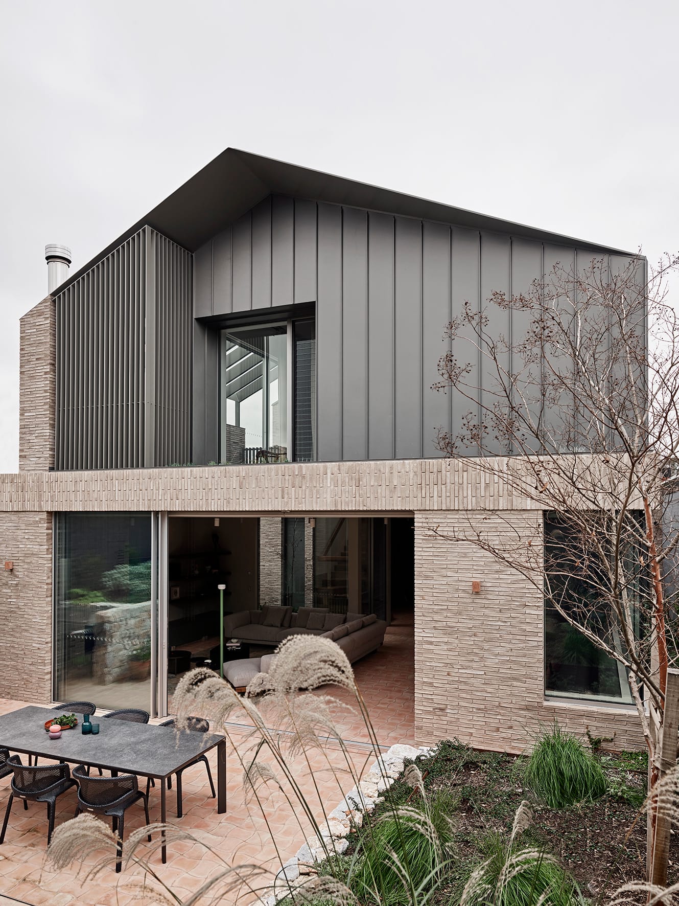 Terra Firma by RobsonRak. Photography by Mark Roper showing the rear facade of this new house