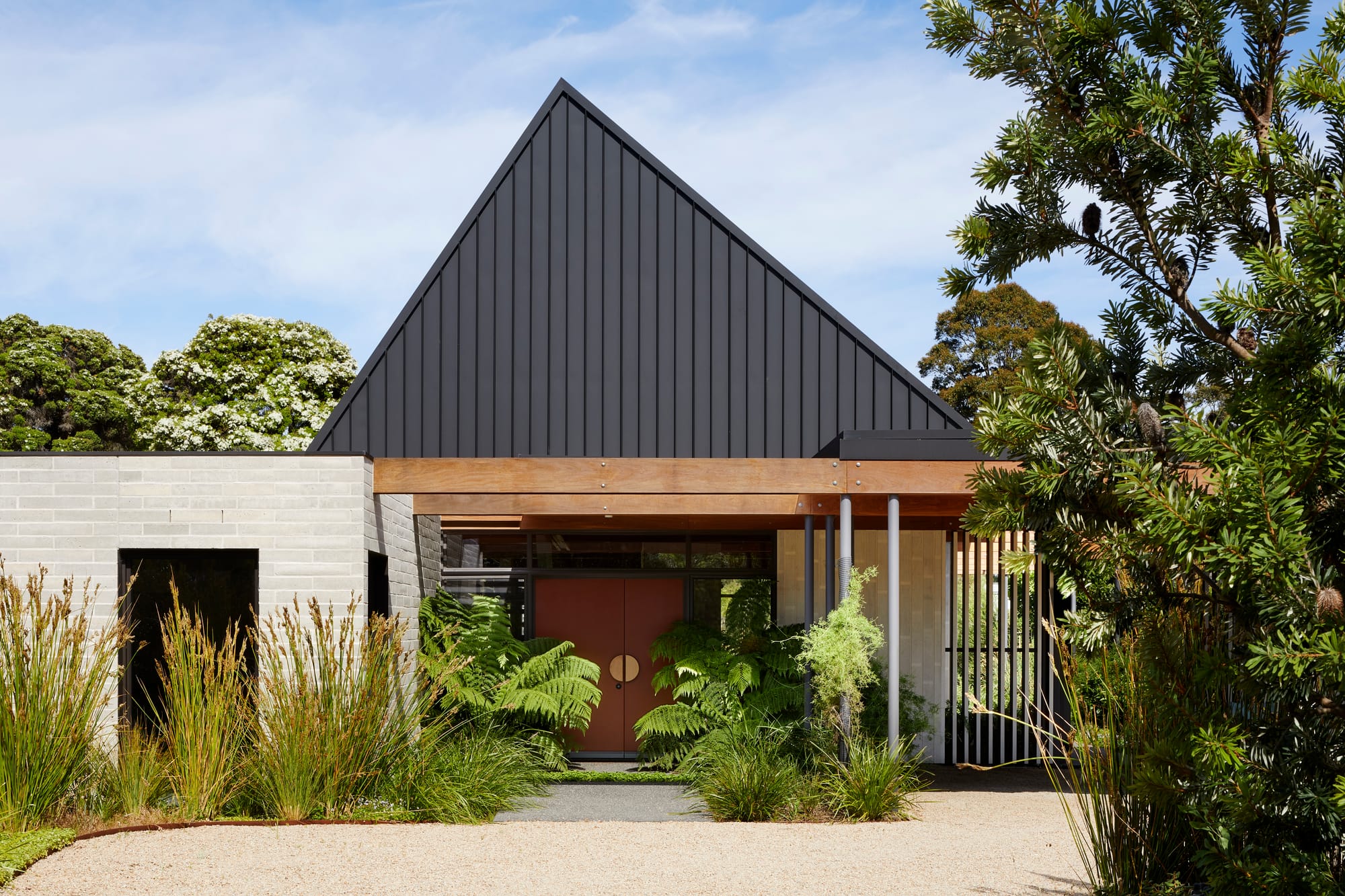 An exterior shot of the Mt Eliza House showing the front door and garden