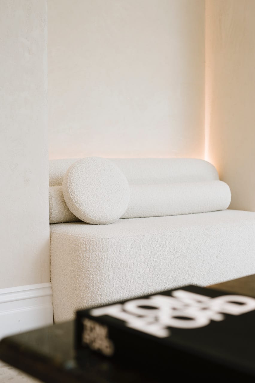 A detail shot of a Made Furniture sofa in white with a Tom Ford book in the foreground