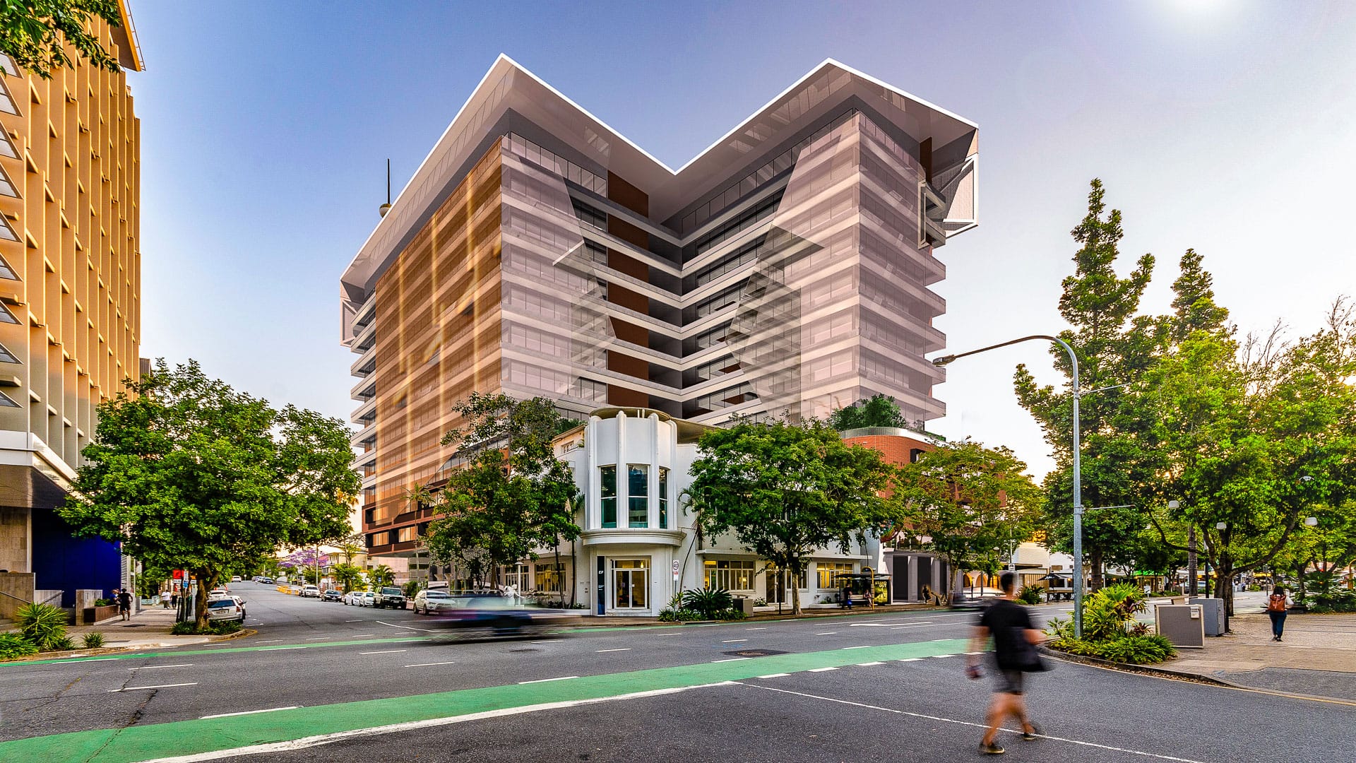 South Brisbane Mixed Use by 77 Architecture. Copyright of 77 Architecture. Streetview of multi-level mixed-use building on street intersection. 