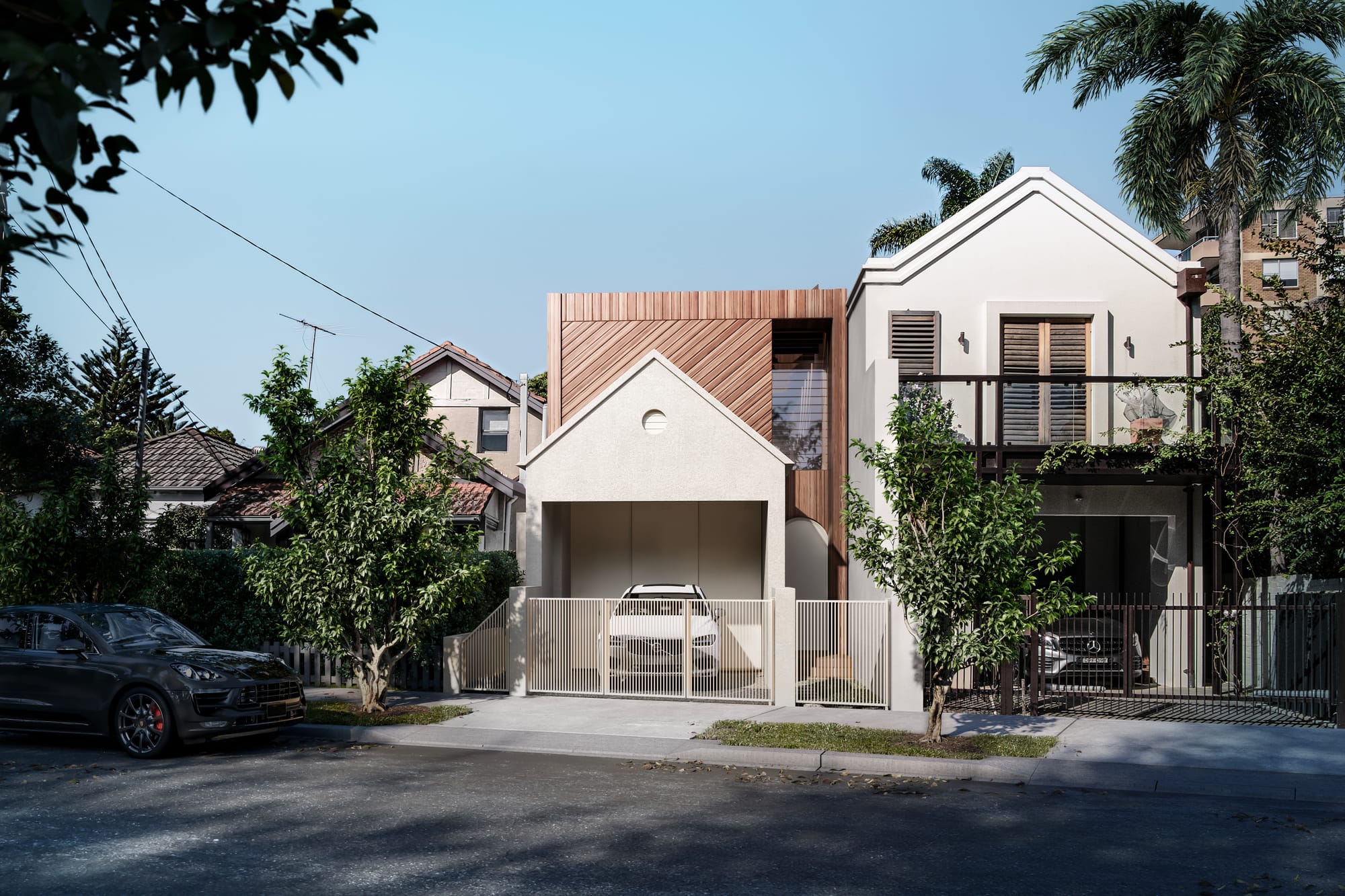 Riddell Street by Studio Shand. Imagery by Lara Clemente. Street facade of double-storey home. Upper storey clad in timber. Pitched roof on ground floor above exposed carport. 