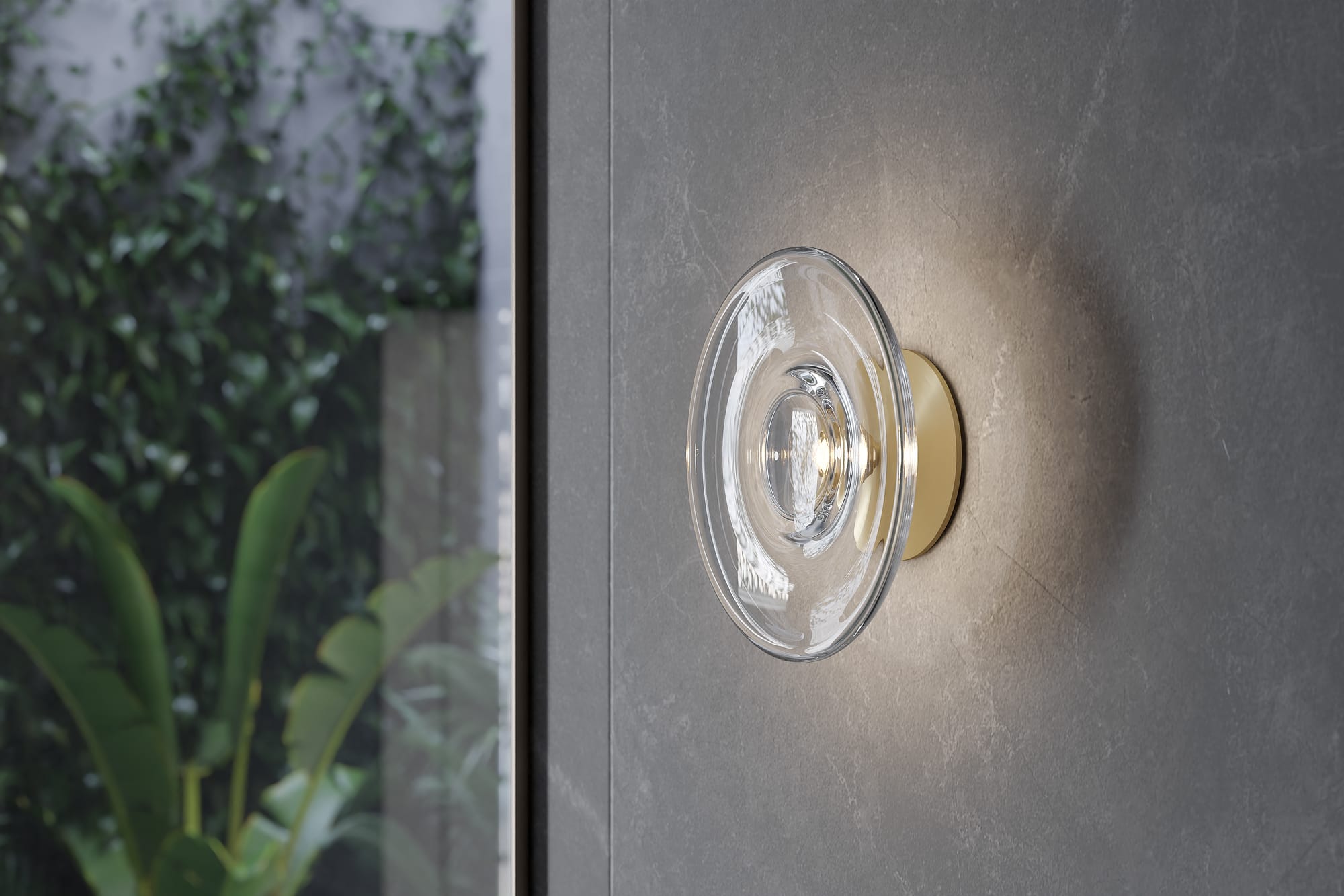 Sol Round Wall Light by SOKTAS. Copyright of SOKTAS. Closeup of glass and gold wall sconce on tiled bathroom wall. 