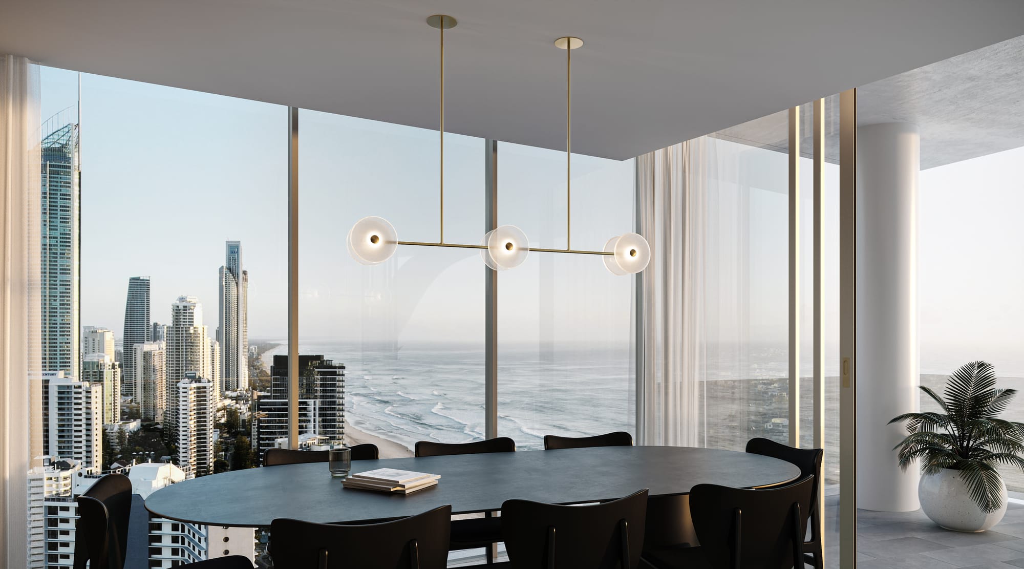 Coral Linear Rod 6 Pendant Light by SOKTAS. Copyright of SOKTAS. Gold and glass pendant light hanging above dining table. City and ocean views through window in background. 
