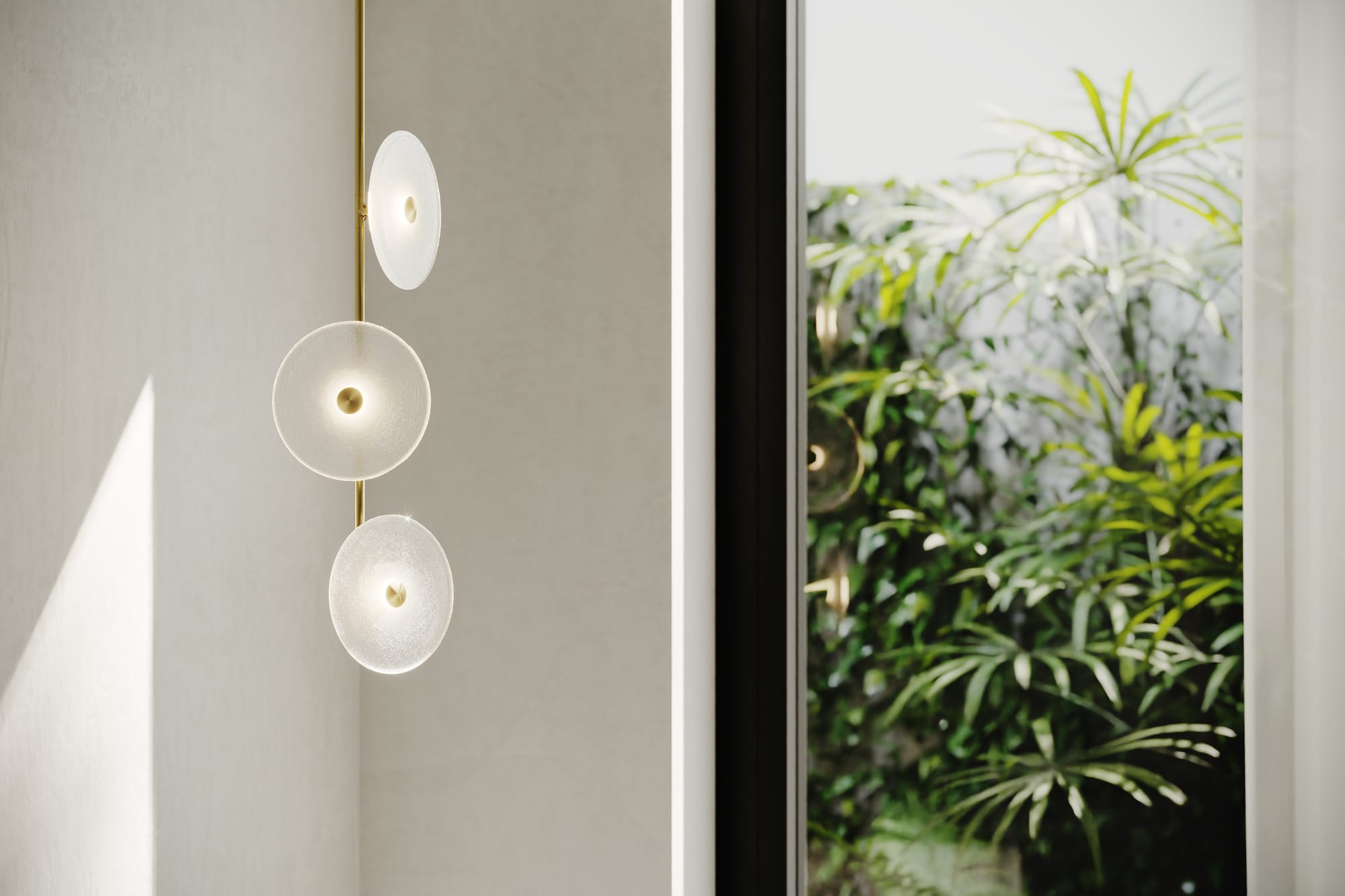 Coral Trio Off Centered Pendant Light by SOKTAS. Copyright of SOKTAS. Abstract pendant light hanging in corner, made of three glass dishes attached to gold pole, facing in different directions. 