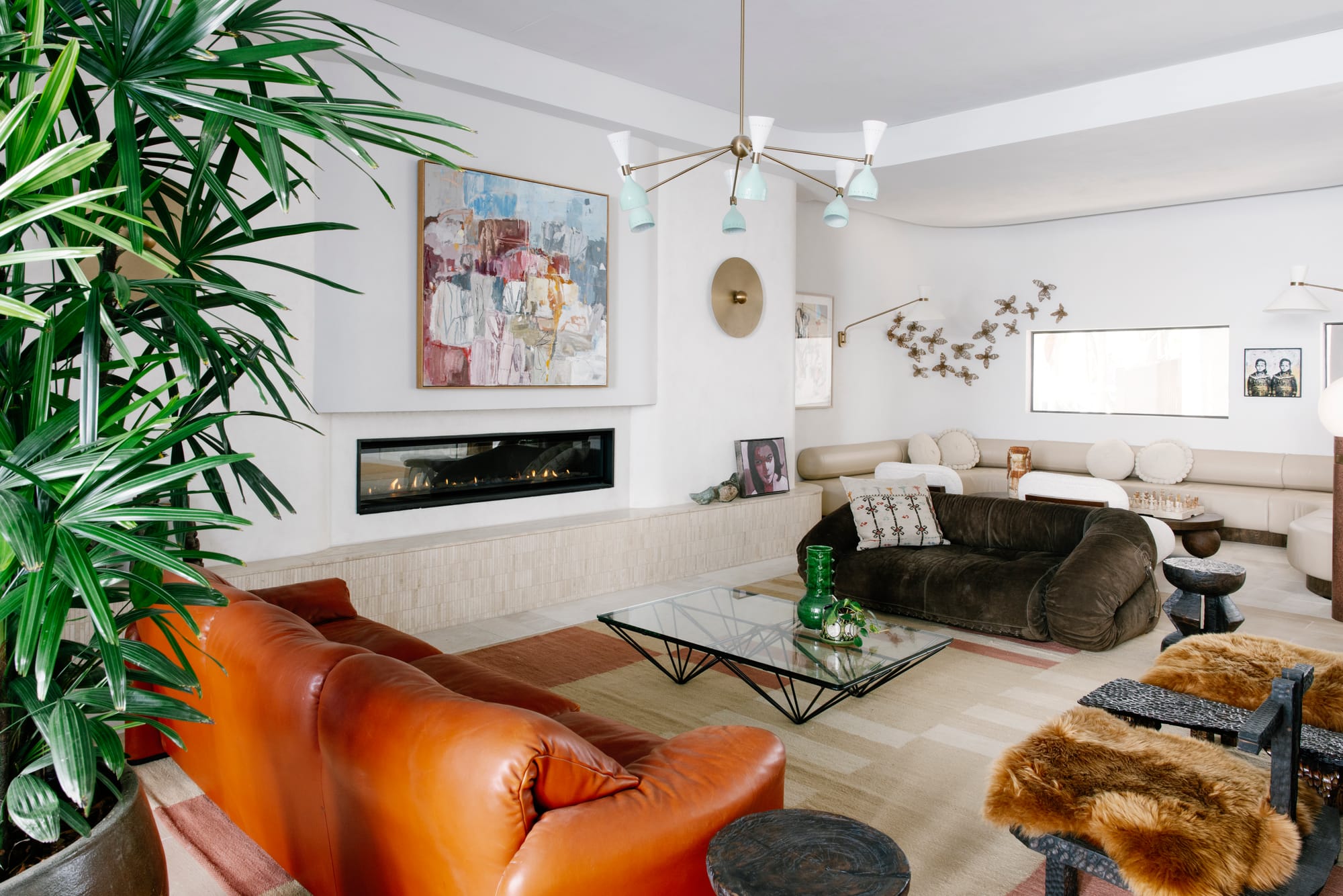 An interior shot showing the eclectic interiors of the Byron bay boutique hotel communal areas with a feature fireplace