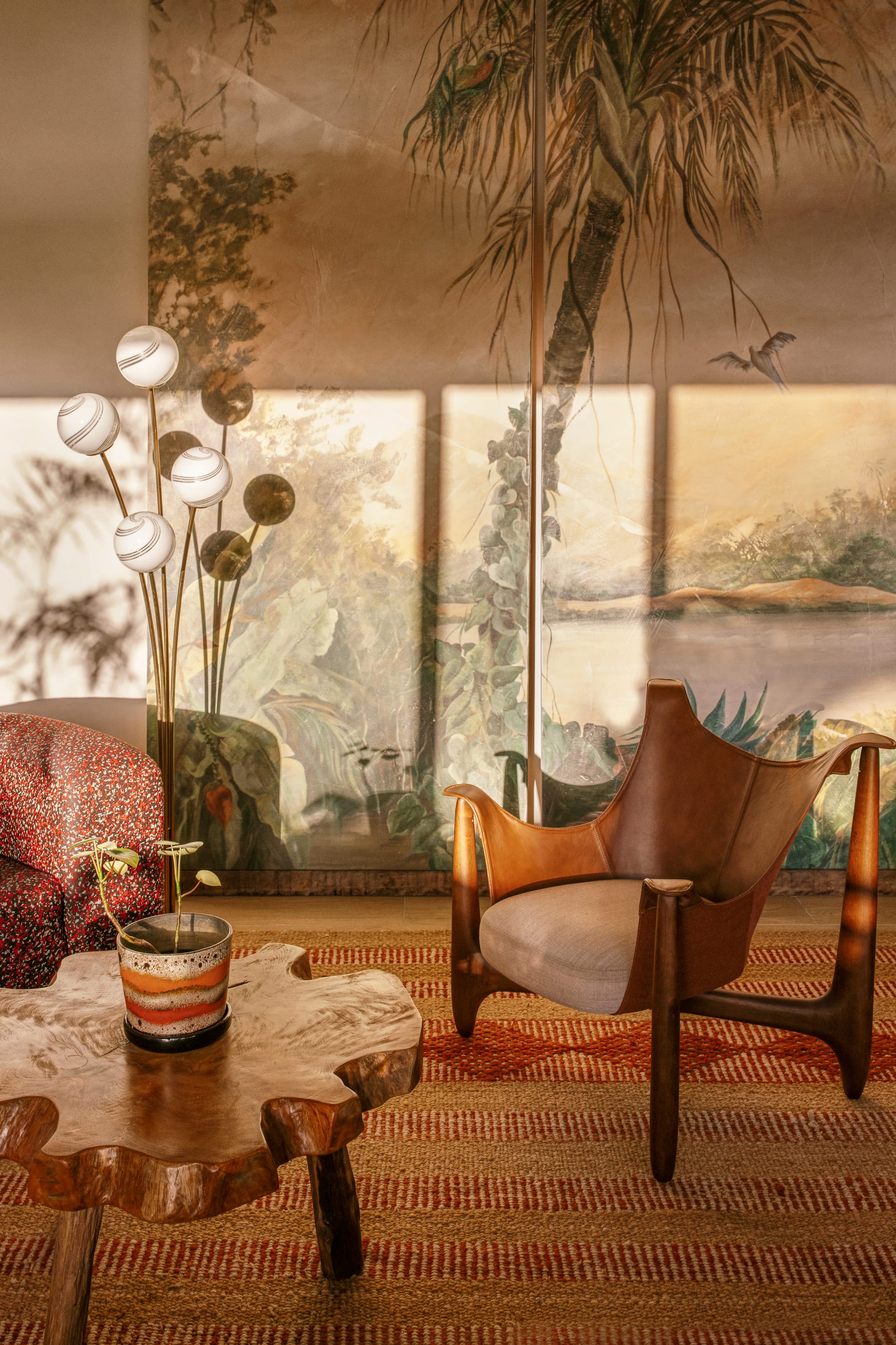 An interior detail shot showing the eclectic interiors of the Byron bay boutique hotel communal areas with an occasional chair and a feature coffee table