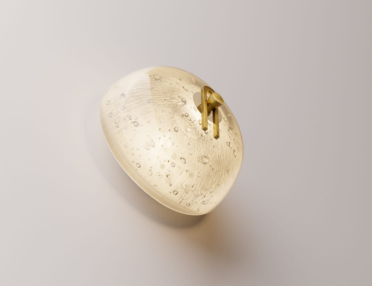 Point Five by South Drawn. Image copyright of South Drawn. Low angle of domed sconce with bubbled texture. Sconce is emitting warm light and has a gold pin on the front.