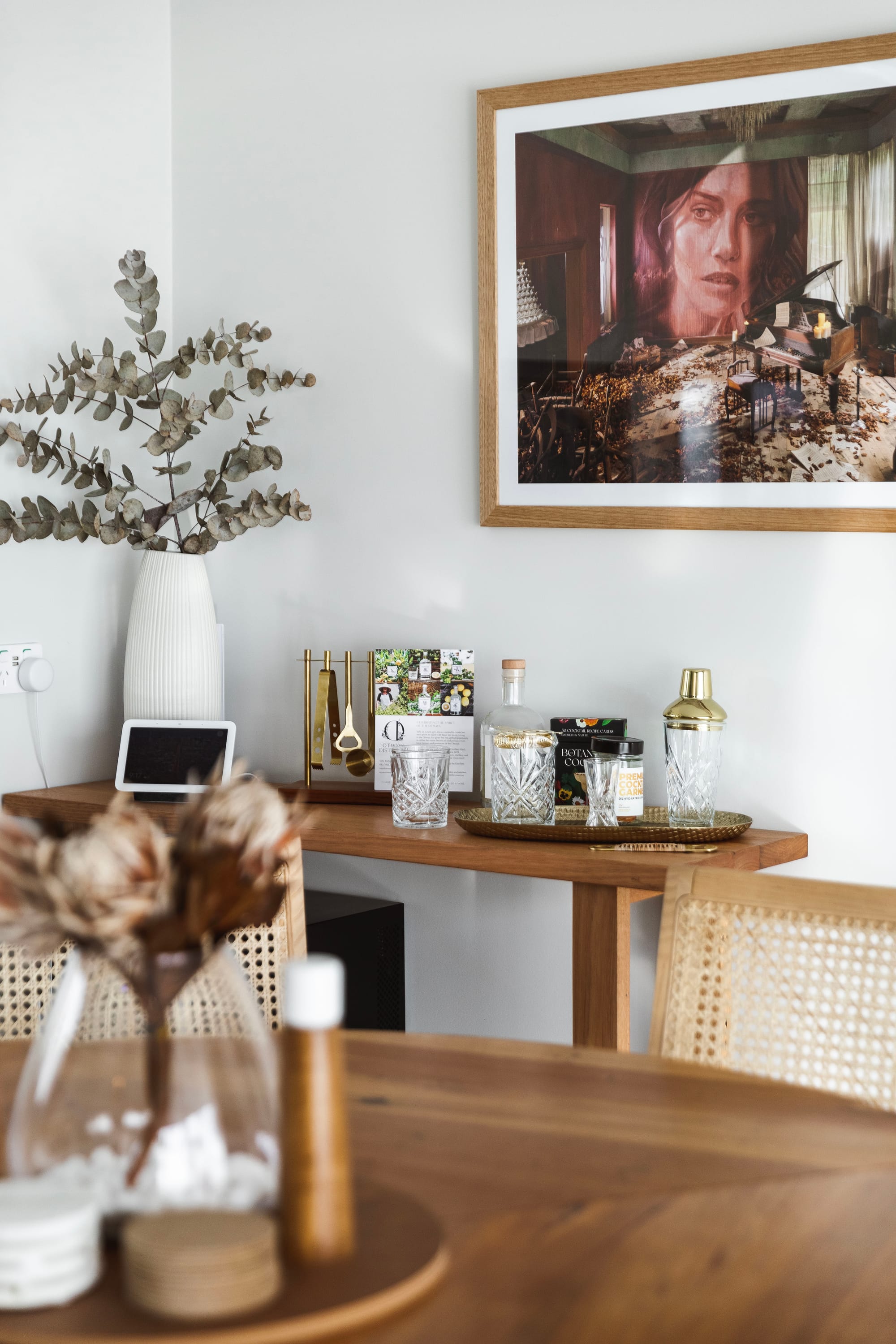 Forrest Haus Retreat. Images copyright of Forrest Haus Retreat. Timber dining table with rattan chairs. Timber bar cart in back. 