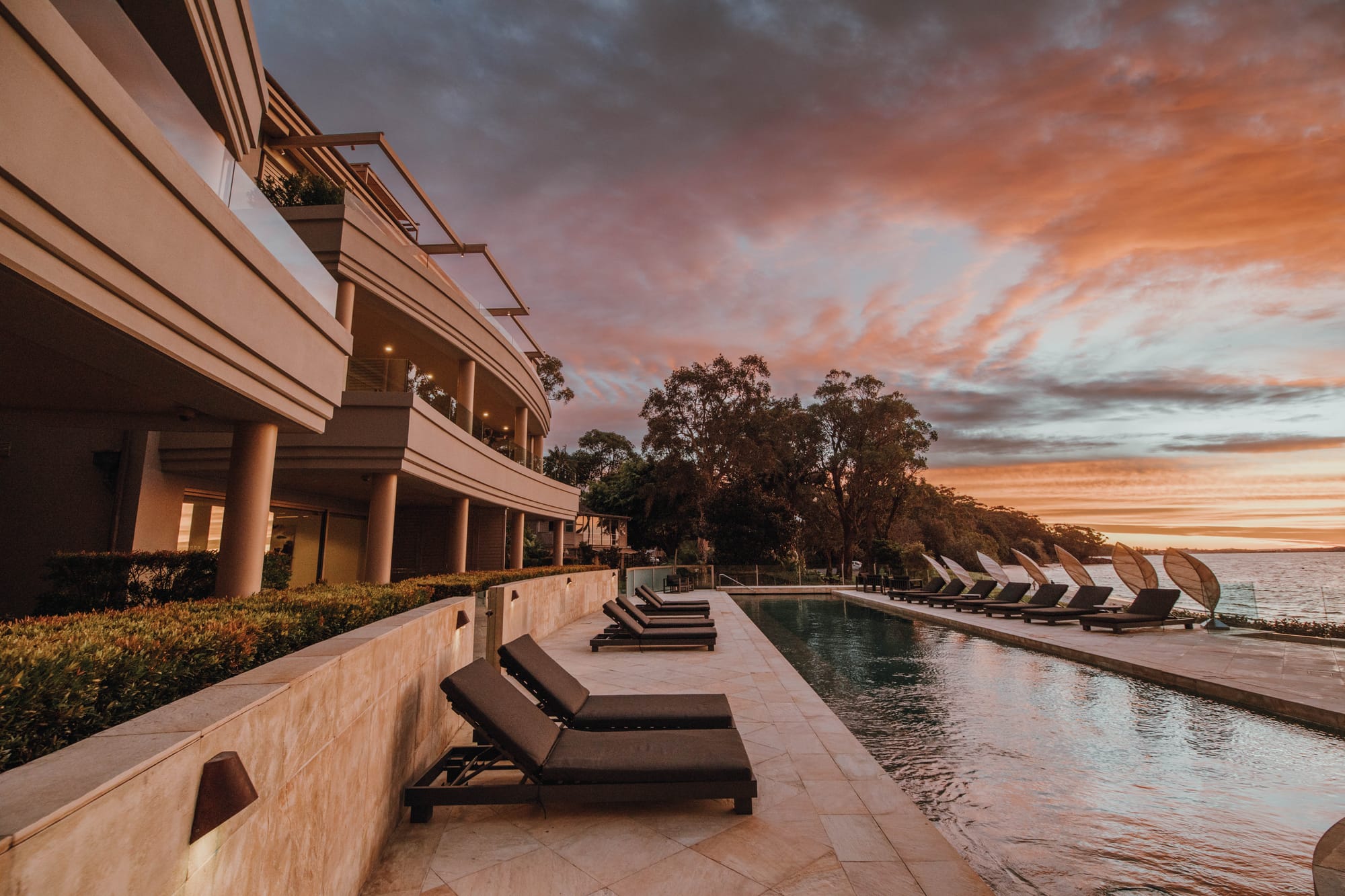 Amarna Luxury Beach Resort. Photography by Will Salkeld. Outdoor pool area with tiled floor.